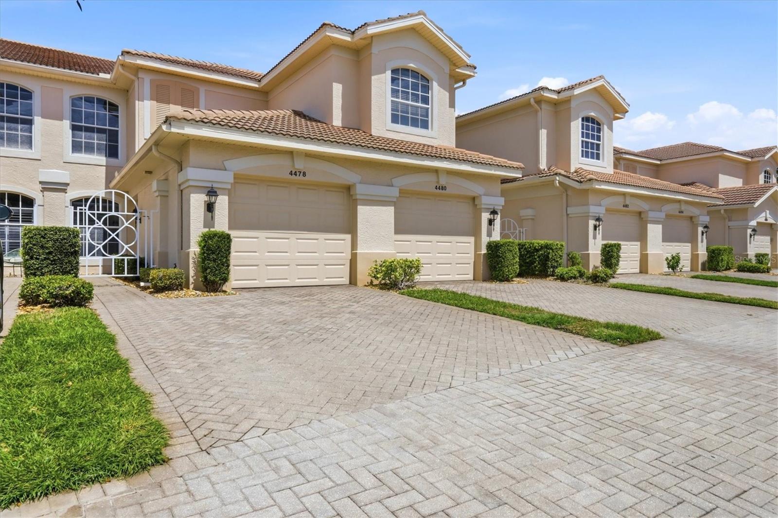 Welcome to Arielle on Palmer Ranch, where everyday living feels like a private escape in one of Sarasota's most desirable gated communities. This ground-floor residence offers the ease of single-level living with no stairs, making everyday access simple and convenient while blending comfort and practicality in a beautifully maintained setting. Recent improvements include brand-new luxury vinyl plank flooring installed in May 2026 throughout the main living areas, creating a bright, modern, and cohesive look. The home also features a brand-new Carrier air conditioning system installed in 2025, complete with a new thermostat and transferable warranty, providing energy-efficient comfort and valuable peace of mind for years to come. Being sold turnkey furnished, the residence comes fully equipped with furniture, housewares, and essentials for an effortless move-in.

With over 1,554 square feet under air and 1,987 total square feet, this spacious two-bedroom plus enclosed den, two-bath condominium lives comfortably like a single-family home while offering the convenience of condominium ownership. The condominium association fee includes water, internet service, basic cable, exterior maintenance, roof maintenance, and professional landscaping, providing exceptional value while simplifying everyday living. The living room is furnished with a high-end Natuzzi leather sofa and coordinating leather recliner, delivering both quality and comfort.

Inside, three sets of sliding glass doors invite natural light to fill the home, brightening the living room, kitchen, and primary suite while creating a seamless connection to the outdoors. The generous layout features defined living spaces that offer both comfort and functionality, creating an ideal flow for everyday living and entertaining. The spacious screened lanai extends the living area, providing a peaceful setting to enjoy morning coffee or unwind in the evening while overlooking a lush preserve backdrop with tranquil pond and creek views nestled among mature Florida foliage. The natural setting creates a sense of privacy and serenity rarely found in condominium living. The flexible enclosed den is ideal as a home office, media room, hobby room, or additional guest space. The primary suite features two walk-in closets, abundant natural light, and peaceful preserve views with glimpses of the pond beyond. A separate indoor laundry room adds everyday convenience. An attached one-car garage, extended two-car driveway, and abundant guest parking provide a rare level of ease and practicality.

Residents of Arielle enjoy a beautifully maintained gated community featuring a heated pool overlooking a serene pond and barbecue areas perfect for outdoor gatherings. Just outside the gates, the Legacy Trail offers miles of scenic pathways connecting downtown Sarasota to downtown Venice, ideal for biking, walking, and enjoying Florida's outdoor lifestyle.

Ideally located less than five miles from Siesta Key Beach, this home also places you within easy reach of downtown Sarasota, St. Armands Circle, Lido Key, and Nokomis Beach. Surrounded by exceptional dining, shopping, recreation, and coastal attractions, this residence presents an outstanding opportunity to enjoy the very best of Sarasota living.