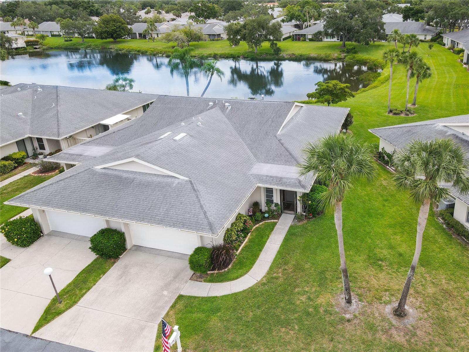 Discover the perfect blend of comfort, privacy, and convenience in this beautifully updated lakefront villa located in the highly sought-after Center Gate Village, a desirable 55+ community. A maintenance-free Sarasota lakefront community. This move-in ready, spacious 2-bedroom, 2-bathroom, 2-car garage villa features serene lake views from its private setting. Recent improvements in this updated home provide peace of mind and modern appeal, including updated kitchen appliances, A/C with heat pump, water heater, luxury flooring, LED track lighting, ceiling fans, bathroom fixtures and vanities, custom real wood cabinetry, and matching granite countertops in both the kitchen and bathrooms. Designed with comfort in mind, this home offers cathedral ceilings, generously sized rooms, and an inviting open floor plan that creates a bright and airy atmosphere. The spacious screened lanai is the perfect place to relax, enjoy your morning coffee, or watch the abundant wildlife on the picturesque lake. The thoughtful layout provides both privacy and functionality, making it ideal for everyday living as well as entertaining family and friends. Guests will feel right at home in this welcoming residence. Residents of Center Gate Village enjoy access to a heated community pool and a large lakeside observation deck, providing the perfect setting to socialize, relax, and enjoy Florida's year-round sunshine. Ideally located in the heart of Sarasota, this villa is just minutes from shopping, dining, medical facilities, houses of worship, Sarasota-Bradenton International Airport, world-class beaches, and spring training facilities for Major League Baseball teams. Nearby attractions include Nathan Benderson Park, renowned for world-class rowing events, and University Town Center (UTC), one of the area's premier shopping and entertainment destinations. Enjoy easy access to Tampa's professional sports venues, approximately one hour away, while Orlando's theme parks, including Disney, and the beautiful beaches and attractions of Naples are within a convenient 90-minute drive. Whether you're seeking a seasonal retreat or a year-round Florida residence, this move-in-ready lakefront villa offers the lifestyle you've been searching for.