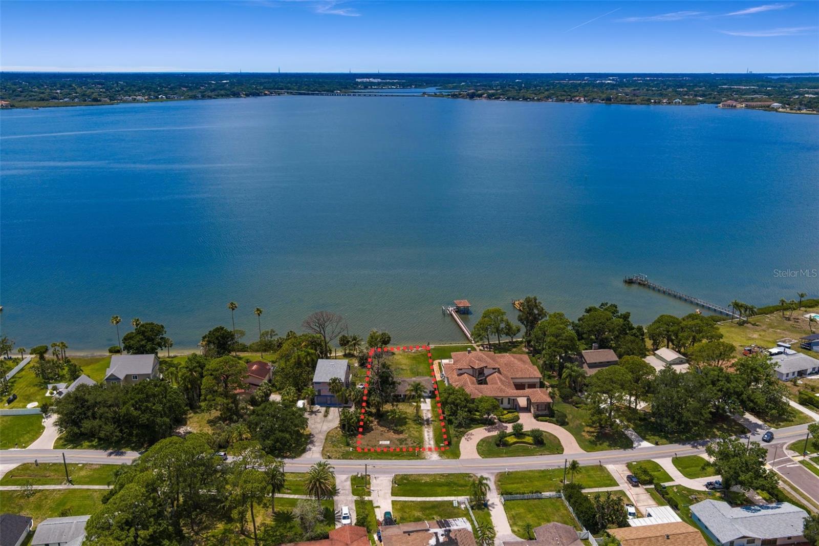 Exceptional waterfront opportunity on one of Oldsmar’s most desirable streets. Situated on a 75x205 (.33 acre) waterfront homesite overlooking beautiful Old Tampa Bay, this property presents a rare opportunity to create a custom luxury estate in an area experiencing significant redevelopment and impressive new construction. Currently utilized as a vacation rental, the home offers income producing potential while future plans take shape, though the true value lies in the land and its exceptional waterfront setting. For water enthusiasts, the lifestyle possibilities are endless. Launch a kayak or paddleboard from your backyard, enjoy boating and jet skiing on the Bay, or simply unwind while taking in panoramic water views and breathtaking sunset skies. With no HOA or deed restrictions, there is added flexibility and ample room for boat and RV parking. Ideally located approximately 20 minutes from Tampa International Airport and about 25 minutes to the Gulf beaches, the property is also just down the street from RE Olds Park and offers convenient access to pickleball, Mobbly Beach, Veterans Memorial Park, scenic biking and walking trails, dining, shopping, and everyday conveniences. Offering a unique blend of waterfront serenity and exceptional accessibility, this is a rare opportunity to create a one of a kind coastal retreat where the lifestyle is just as remarkable as the setting.