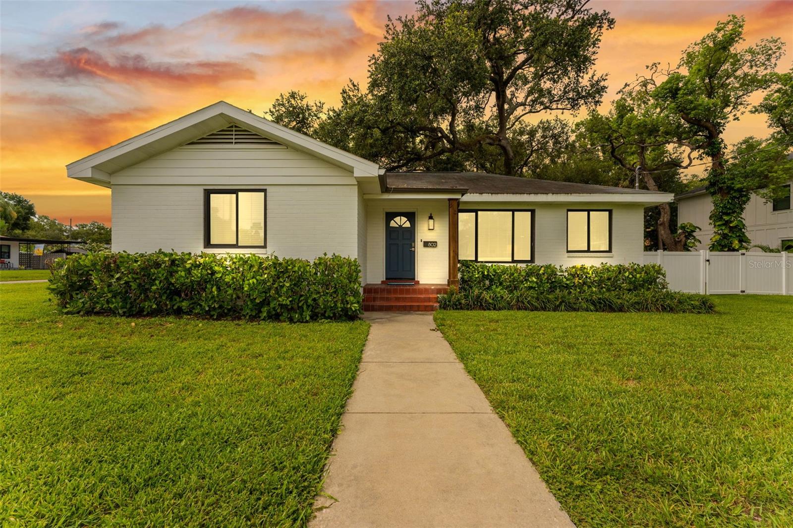 Virtually Staged. Welcome to this beautifully updated brick home, perfectly situated on an oversized double lot in one of Tampa's most desirable neighborhoods just a short stroll from Armature Works, the Riverwalk, and some of the city's best dining and entertainment.

Designed for both everyday living and effortless entertaining, the open-concept floor plan features spacious living and dining areas that flow seamlessly into the stylish kitchen. The kitchen is appointed with shaker-style cabinetry, granite countertops, a coordinating backsplash, and a full suite of modern appliances.

Thoughtful upgrades throughout the home provide both comfort and peace of mind, including engineered hardwood flooring throughout the main living spaces, plush carpeting in the bedrooms, brand-new triple-pane hurricane-impact windows with Low-E glass, a newer roof(2018), newer HVAC system(2016) with UV air filtration and humidity control. Detached garage/structure is 576 sqft and not included in the heated square feet of the home. 

Step outside to your private courtyard, where the oversized patio creates the perfect setting for outdoor dining, entertaining, or simply relaxing. The detached garage offers exceptional flexibility with approximately 350 square feet of finished bonus space, including a dedicated office and an additional multi-purpose room—ideal for working from home, a fitness studio, hobby space, or guest overflow.

Offering an unbeatable combination of location, modern upgrades, versatile living space, and an expansive double lot, this move-in-ready home is a rare opportunity in one of Tampa's most sought-after areas. Schedule your private showing today and experience everything this exceptional property has to offer.