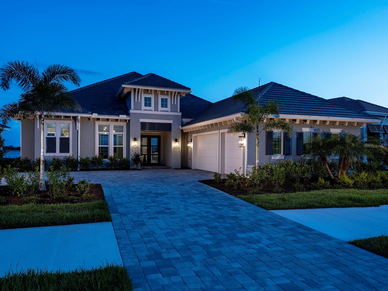 Welcome to Wild Blue at Waterside, where luxury coastal living meets natural beauty. Stock Luxury Homes presents an exquisite blend of timeless architecture, semi-custom details, and expansive open spaces. This stunning MODEL HOME features 3 bedrooms, 4.5 bathrooms, a spacious Great Room, elegant Dining Room, a dedicated Study, and 3 car garage.   Enjoy seamless indoor-outdoor living with a dynamic outdoor space complete with a pool, spa, outdoor kitchen and fireplace. This MODEL HOME is being sold with leaseback terms through February of next year. This Quick Close Sales Price includes the furniture and decor package!