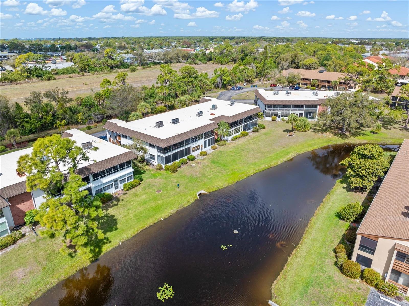 QUAILS RUN CONDO IN ENGLEWOOD, FLORIDA! 55+ FRIENDLY COMMUNITY! Enjoy peaceful Florida living with an amazing view of the glistening lake and spray fountain right from your own private screened, covered lanai. Located just minutes from the beach, this charming second-floor condo offers comfort, convenience, and beautiful scenery all in one place. From the moment you step outside onto the lanai, you can relax while watching the sunlight shimmer across the water and listening to the gentle sound of the fountain. Tall, mature tropical palm trees sway in the breeze, creating the perfect setting to unwind and enjoy the warm coastal lifestyle that Englewood is known for. This inviting 1-bedroom, 1-bath condo features thoughtful updates that add both style and peace of mind. The interior has been freshly painted, creating a bright and welcoming space throughout the home. The newer A/C system and newer roof add value and efficiency, while the new vinyl waterproof plank tile flooring brings a modern look that is both durable and easy to maintain. The cozy kitchen includes tile flooring and a new kitchen vent, offering a functional space for preparing meals. The spacious living and dining area provides plenty of room to relax or entertain. The large primary bedroom features sliding glass doors that open directly to the oversized screened lanai, allowing natural light to fill the room. Two large closets provide excellent storage, and the generous A/C room offers additional space for convenience and organization. Step outside to the oversized screened lanai and enjoy the peaceful lakefront view every day. This home sits in one of the best locations in the community, with the clubhouse, pool, and shuffleboard courts all within easy walking distance. Quails Run offers a vibrant lifestyle with plenty of activities and gathering spaces to enjoy throughout the year. The HOA fee includes water and sewer service, cable TV, community pool maintenance, exterior landscaping, clubhouse access, shuffleboard courts, and a wide variety of community activities. The location is ideal for enjoying everything Englewood, Florida has to offer. Beautiful Gulf beaches are only minutes away, perfect for soaking up the sun or enjoying breathtaking sunsets. The nearby Dearborn Art District features charming shops, local art galleries, and a popular farmers market. Shopping, restaurants, Englewood Hospital, and easy access to I-75 are all just a short drive away. Golf enthusiasts will also appreciate the many excellent golf courses nearby. Affordably priced and ready to enjoy, this lovely condo is a wonderful opportunity to own a piece of Florida living. Call today to schedule your private showing!