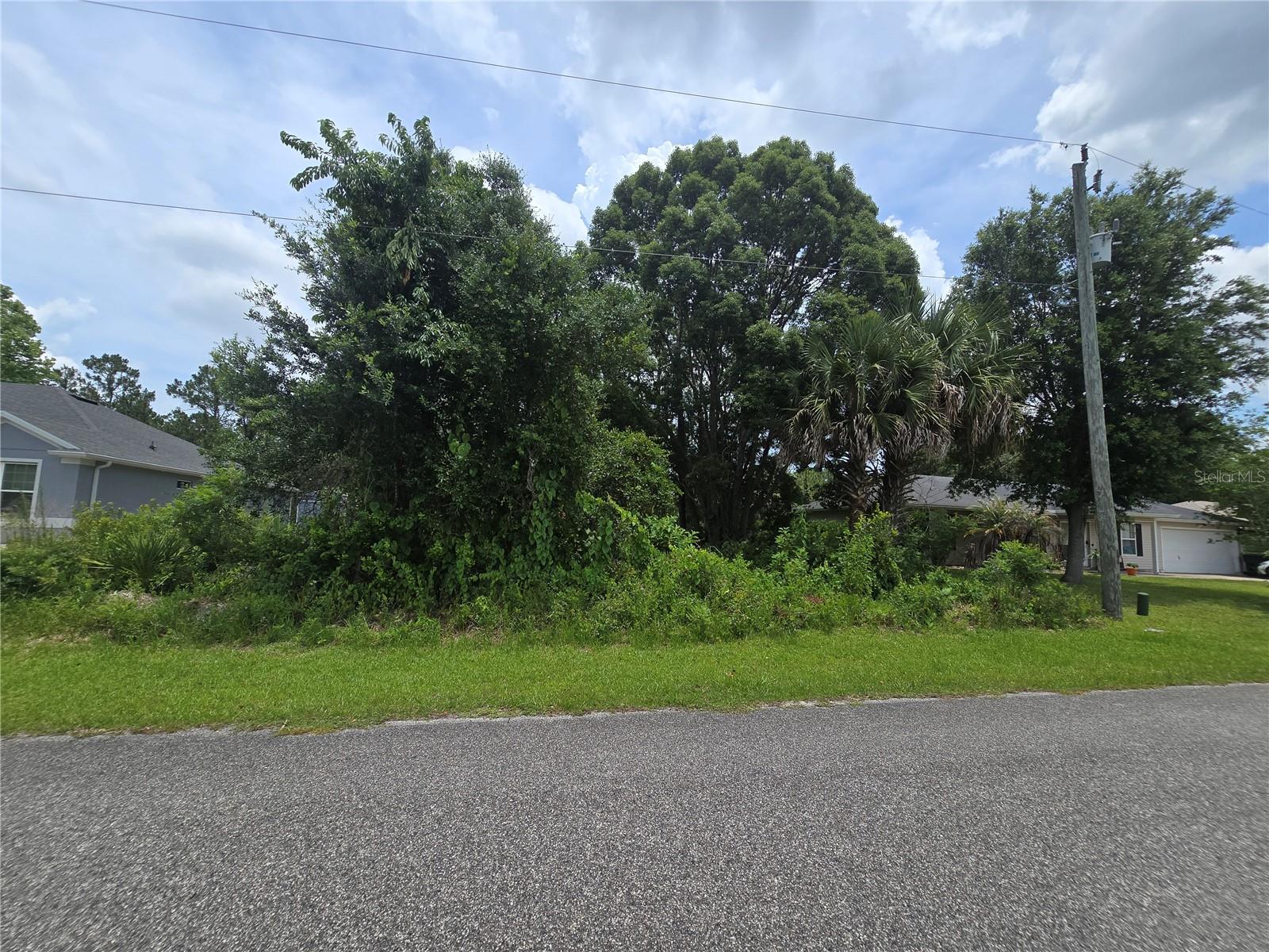 Build your dream home on this desirable cul-de-sac lot surrounded by well-maintained homes in an established neighborhood. With only a limited number of homes on the street and a scenic lake located just across the way, this property offers a unique setting with a sense of space and openness.  Zoned for single-family residential use, this homesite provides an excellent opportunity to create the home you've been envisioning. Conveniently located near shopping, dining, AdventHealth Palm Coast, the Town Center, and everyday amenities, you'll enjoy easy access to everything you need. Plus, Flagler Beach is just a short drive away, offering the perfect spot to enjoy the Florida lifestyle.  Whether you're ready to build now or planning for the future, this lot offers a convenient location and a wonderful opportunity to bring your vision to life.