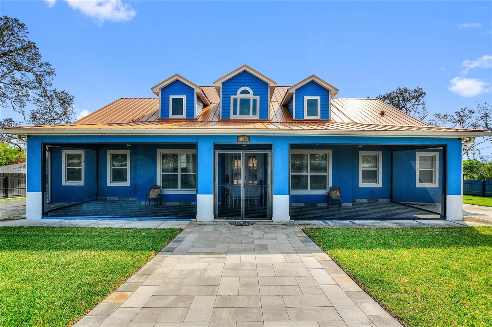 Welcome to 803 N 24th Street. NO HOA. NO CDD. A CUSTOM BUILT home with all of the upgrades you can imagine. 4 BEDROOMS and 3 FULL BATHROOMS. Arriving you will enter through a motorized gate that surrounds the entire lot. It is your choice to park in front of the home, in the rear or inside the two-car garage. Two OVERSIZED screen porches. As you enter through the front door you will be greeted by 14-FOOT CEILINGS throughout the home and the perfect temperature as the home has spray foam insulation in the entire house. After the grand entry is the open concept kitchen and living room. The kitchen is fitted with all KITCHEN AID APPLIANCES and the hood is vented outside. There is a large WALK-IN PANTRY and room for plenty of barstools and a table for eating. The primary bedroom is just behind the living room with a grand hall to the primary bathroom including two separate vanities, walkthrough shower, soaking tub and toilet room. Two large walk in closets with custom cabinetry complete the primary suite. Across the house are bedrooms two and three with a jack and jill bathroom. Then a laundry room with ample counter space for folding and plenty of storage. The property also has a large private office and bonus space which is currently used as a gym. The fourth bedroom has its own on suite full bathroom. The back screened porch has a FULL OUTDOOR KITCHEN with plumbing and gas hook up. The property has two CARRIER A/C UNITS. There is a shed in the backyard. Located just a block away from Haines City Soccer Complex and Larry Parrish Baseball Complex. This property has everything you dreamed of ready for you to move in. Come see this gem today.