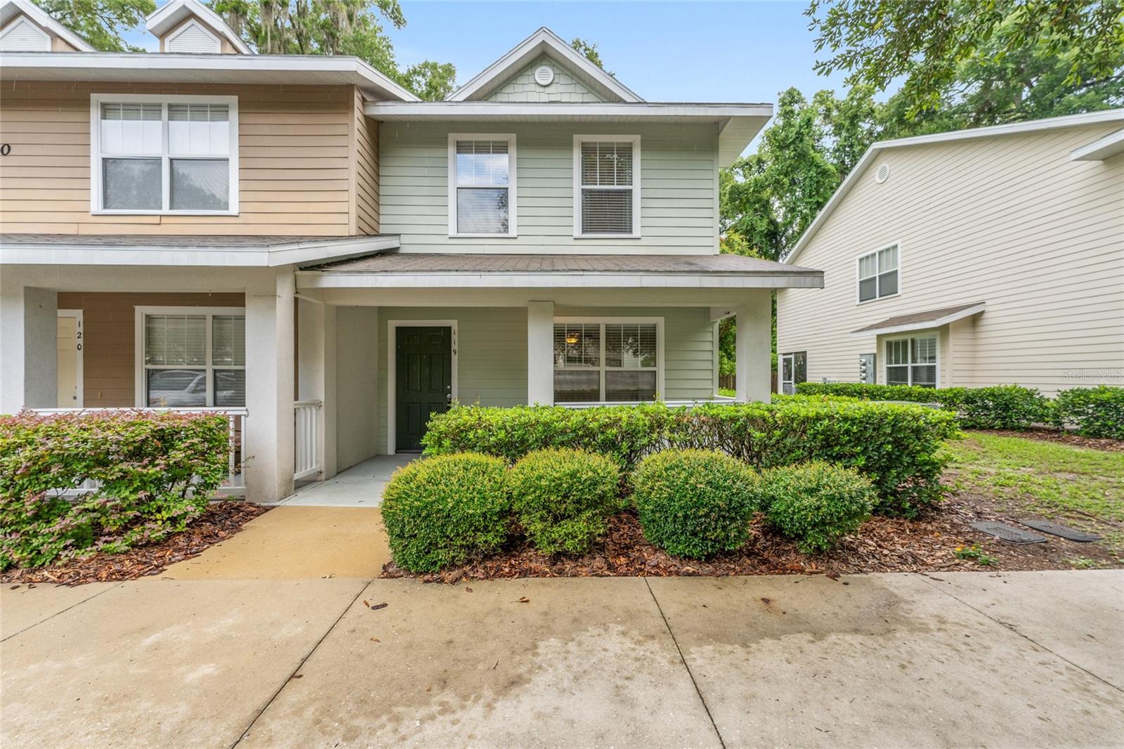 Virtually Staged. Beautifully maintained 3-bedroom, 2.5-bath end-unit townhome offering exceptional natural light, added privacy, and an unbeatable SW Gainesville location just across from Celebration Pointe! This spacious home features extra side windows exclusive to end units, crown molding, and ceramic tile flooring throughout the main living areas. The well-appointed kitchen is complete with white cabinetry, granite countertops, ceramic tile flooring, a pantry, a convenient laundry closet, and a sunny breakfast nook with access to the back porch.
Upstairs, all three bedrooms feature ceiling fans, with the spacious primary suite offering a private en-suite bath. The two additional bedrooms are connected by a convenient Jack-and-Jill bathroom, making the layout ideal for all occupants.
Relax on the covered front porch or unwind on the screened rear porch overlooking a peaceful wooded area, providing exceptional privacy and a tranquil setting. Built with concrete firewall construction between units for added peace of mind.
Recent updates include a new HVAC system (2023) and water heater (2024). The community offers beautifully landscaped green spaces, mature trees, and a fenced dog park. The HOA provides outstanding value by covering exterior maintenance, roof replacement, building hazard insurance, and a 24-hour monitored fire sprinkler system.
Conveniently located on the bus route with easy access to I-75, Butler Plaza, and Celebration Pointe's premier shopping, dining, entertainment, and fitness options—all within approximately one mile. The home also includes one reserved parking space plus ample guest parking nearby.