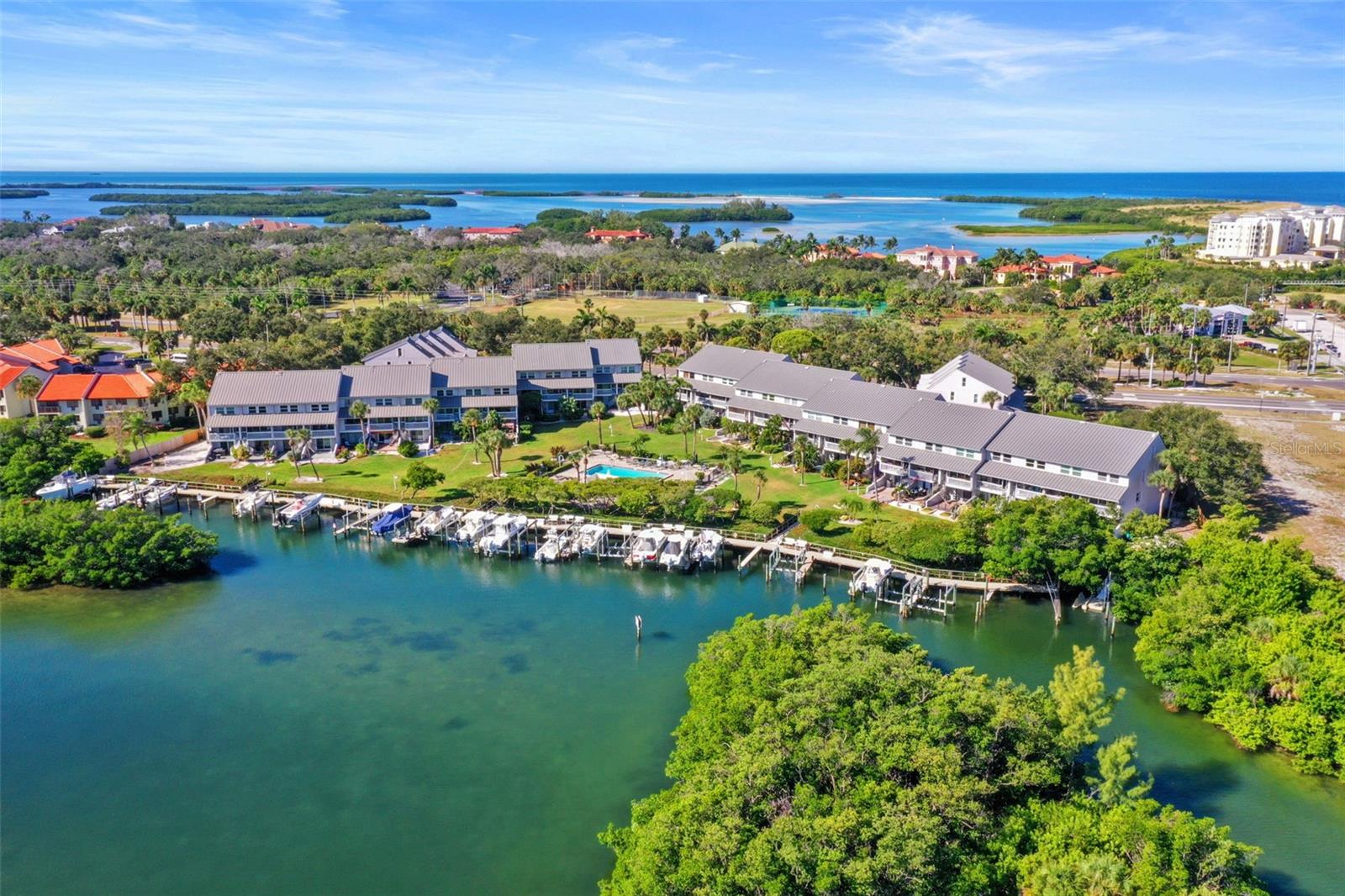 Motivated Seller!! Lowest priced townhouse with a water view on Pinellas Bayway!!!
Welcome to Pirates Cove—a serene waterfront community nestled on the shores of Tierra Verde. This beautifully maintained two-bedroom, two-bath townhome with a loft and bonus room offers a true coastal retreat surrounded by lush tropical landscaping and tranquil water views of Boca Ciega Bay.
The open-concept living and dining areas feature vaulted ceilings and sliding doors leading to a private balcony overlooking a park-like setting. The loft area adds flexibility for an office, hobby, or reading nook, while the spacious bonus room on the ground level opens to a private patio, perfect for relaxing or entertaining outdoors.
Recent updates include a new metal roof, Bahama shutters, and a new skylight in the primary suite. Residents of Pirates Cove enjoy a temperature-controlled pool, community dock with kayak launch, and the chance to spot manatees and enjoy the waterfront lifestyle year-round. This pet-friendly community (two large dogs allowed) is surrounded by three acres of tropical open space and is just moments from the Pinellas Trail, Fort De Soto Park, marinas, and local dining.
Live the relaxed island lifestyle and discover why Pirates Cove is one of Tierra Verde’s most loved waterfront enclaves.