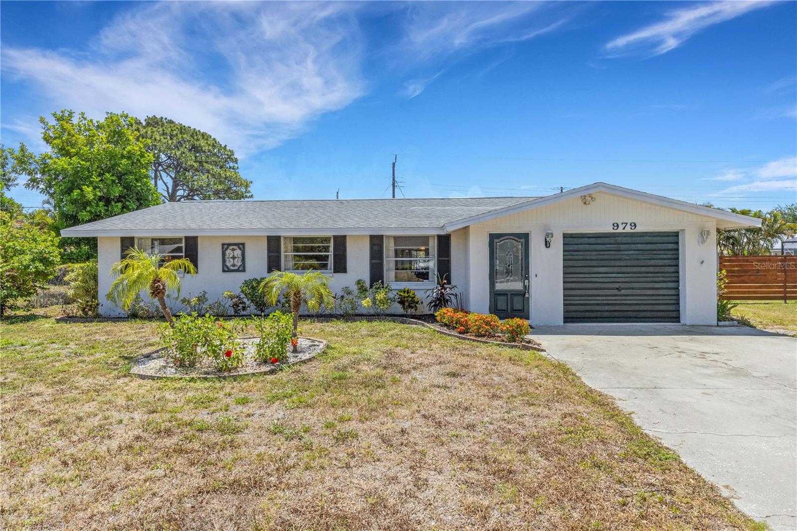 Rare opportunity to purchase one of the few original four bedroom homes west of the trail in South Venice. Located on a quiet low traffic street, this four bed-two bath home is one of only eight four bedroom homes to come on to the market on the west side of South Venice north of Alligator Creek in the past five years. The split plan layout separates a primary bedroom with en suite bath and walk in closet to one side of the living and dining area while the other three ample sized bedrooms are located down a hallway with a shared bath. Both bathrooms have tub/shower combinations. The home can be sold fully furnished with one of the bedrooms outfitted as an office/study. The kitchen has it's own dining area just behind the living room and has a sliding door that leads to an expansive 50ft X 10ft lanai that runs the entire length of the rear of the home. this combination offers a great entertainment space for gatherings. The home was last roofed and the water heater replaced in 2020. There’s also an outdoor paver patio for relaxation and mature landscaping in the large and partially fenced backyard. South Venice has a no deed restrictions and NO HOA! However, a small optional community fee grants residents access to a ferry to a private beach, a boat and kayak launch and the community center. It's also home to the Shamrock Nature Center that has recreational and sports facilities and walking trails with a view of the boats traveling the intracoastal waterway. Those seeking both indoor and outdoor living space to enjoy that sought after Florida lifestyle in an optimal location for beach and downtown access should definitely see this home.
