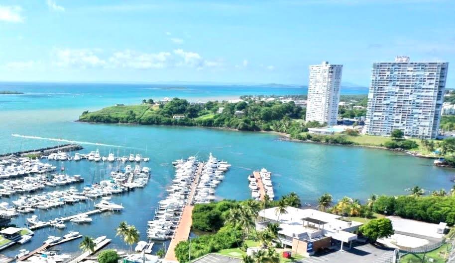 Stunning fully remodeled 2-bedroom, 2-bath apartment in the exclusive Dos Marinas Tower II community in Fajardo, offering breathtaking panoramic views of the marina, the Atlantic Ocean, El Conquistador Resort, and the islands of Icacos and Palomino. This bright and airy unit features ocean views from both bedrooms, custom built in wooden closets, modern finishes, and premium upgrades throughout. Equipped with appliances, three wall-mounted A/C units, washer and dryer (needs repair), on demand water heater, security windows and doors. The resort-style complex provides 24/7 security, two assigned parking spaces, visitor parking, tennis, basketball and pickleball courts, playground, an Olympic-size pool, and multiple gazebos. A move in ready coastal gem—perfect as a primary residence, vacation home, or investment property in one of Fajardo’s most desirable waterfront locations. Appointment requirements: Pre qualification letter and/or proof of funds.