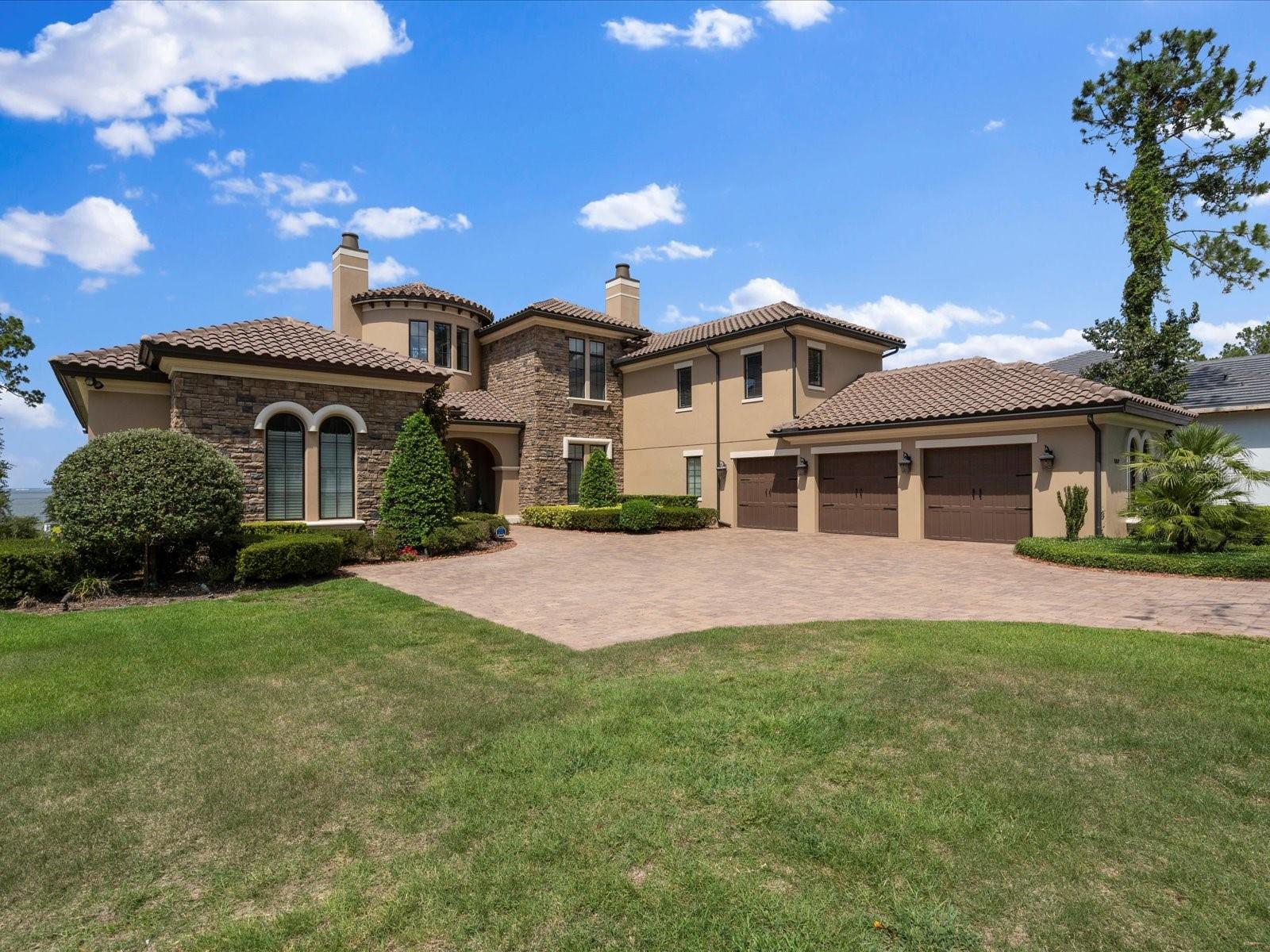 This magnificent custom-built property completed in 2017 offers a luxurious living experience with its impressive features, & boat dock. It's situated on a premium lot of 1.06 acres with panoramic views of Lake Apopka. With a total of 5 bedrooms, 5 bathrooms & 2 half baths, including 2 master bedrooms. Both master bedrooms have stunning lake views, walk-in closets, and spacious en-suite bathrooms. The entryway of the house is turreted, adding a touch of architectural elegance and offering beautiful water views. The living room and formal dining room feature pillared entries, providing a sense of distinction and sophistication. The living room also showcases water views and a lighted cove ceiling. The kitchen is a chef's dream, equipped with top-of-the-line Wolf and Subzero appliances. Upgraded cabinetry and travertine tile flooring add to the overall luxury. The granite island includes a drinking filtration system, ensuring convenience and quality. The first floor master suite is exceptional, with wooden floors, large walk in closets, stand alone tub, large shower, double vanities and built in dressing table, ensuring the height of luxury for any owner. This property offers various amenities for relaxation and entertainment. A gym with a sauna provides the perfect space for exercise and rejuvenation. An office is available for those who require a dedicated workspace. Additionally, an upstairs pub room with a bar offers a great space for entertainment. The house is equipped with an elevator for easy access between floors. Upstairs, you'll find three additional bedrooms, each with its own bathroom. A balcony overlooks the picturesque lake, providing a tranquil spot to enjoy the surroundings. The pool area is truly a resort-style oasis, featuring a large custom pool, a hot tub, and decorative fire bowls. An electronic screened lanai provides an ideal space for relaxation and offers views of the pool and lake. Adjacent to the lanai is a summer kitchen, perfect for outdoor dining, and an outdoor fireplace for cozy evenings.The house is equipped with an internal and external sound system, allowing you to enjoy music and enhance the ambiance inside out outside the property. A 300-foot dock with a boat lift and boat house offers direct access to the lake, providing opportunities for boating and water activities. Comfort and convenience are prioritized with the inclusion of a bug misting system, both at the front and rear of the property, ensuring a pleasant outdoor experience throughout the year. New A/C installed this year. Additional features of the property include a water softening system, crown molding throughout, high ceilings, extra height baseboards, upgraded planting and landscaping, security cameras, gutters, Anderson Series 400 windows for hurricane resistance and heat filtration, an auto power-on natural gas Generac Generator, a 3-car garage with extra storage space, and an extra-long driveway.  The property is located in the prestigious Bella Collina community, known for its beautiful surroundings and amenities. The community features a Nick Faldo designed golf course, a Tuscan-inspired clubhouse with two exceptional restaurants, a gym, a communal pool, tennis courts, and a variety of family events.

Owner occupied so please give 24 hours notice to view. Room Feature: Linen Closet In Bath (Primary Bedroom).