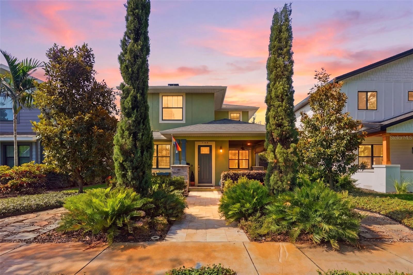 Tucked beneath the tree-lined streets of coveted Historic Kenwood, this exceptional 2019-built residence masterfully blends the timeless charm of a classic bungalow with the comfort, efficiency, and craftsmanship of modern construction. From the moment you arrive, the inviting covered front porch, Bahama shutters, and lush tropical landscaping set the tone for a home that feels both elevated and effortlessly welcoming.

Step inside and experience a space where every detail has been thoughtfully curated to create warmth, character, and functionality. Rich architectural touches—including custom shaker-style ceilings, broad window trim, custom built-ins, and elegant wainscoting—bring depth and personality throughout the home. The open staircase and thoughtfully reimagined layout create an airy, connected flow ideal for both everyday living and entertaining.

At the heart of the home, the inviting living spaces are designed for comfort and style, centered around a cozy electric fireplace and filled with natural light enhanced by plantation shutters and designer window treatments throughout. The downstairs office, which can easily function as a fourth bedroom, offers flexibility for guests, work-from-home living, or growing families, alongside a convenient half bath.

Upstairs, the primary suite serves as a private sanctuary, blending timeless design with everyday luxury. Thoughtfully redesigned, the spa-inspired primary bath offers a refined retreat, while custom shaker-style wainscoting, designer drapery, electric blackout shades, and a spacious walk-in closet with custom storage systems elevate the space with both comfort and sophistication. Two additional bedrooms and a beautifully appointed guest bath complete the upper level, creating the perfect balance of privacy and functionality.

Outside, the property transforms into a true tropical oasis. The heated and cooled pool is surrounded by lush landscaping, an irrigated living wall, covered rear porch spaces, and multiple areas to relax or entertain year-round. An electric retractable awning adds both comfort and convenience, creating the perfect outdoor escape.

Beyond its beauty, this home is packed with thoughtful upgrades and modern conveniences, including a WiFi-enabled water softener, extensive garage storage systems, coated garage flooring, upgraded security cameras and motion sensors, faux wood-grain closet systems, and a hardwired connection for a portable 13,000-watt Duromax natural gas generator that conveys with the property. A detached two-car garage completes this exceptional offering.

This is more than just a home—it’s a rare opportunity to enjoy the character and charm of Historic Kenwood with the peace of mind and luxury of newer construction, all wrapped into one unforgettable property.