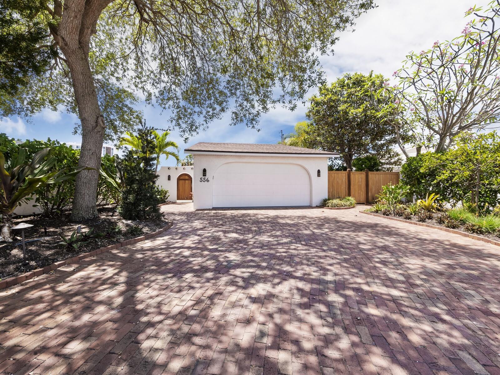 Welcome to 556 North Washington Drive, a captivating waterfront oasis nestled between the pristine sands of Lido Key and the enchanting allure of St. Armands Circle. This prime location offers a unique blend of serene waterfront living and convenient access to top-tier shopping and dining options. This meticulously updated residence boasts three bedrooms and three bathrooms, ensuring ample space for family, guests, or a home office. The property features a new dock and seawall, complemented by impact-resistant windows that enhance both safety and energy efficiency. The heart of the home is adorned with an updated kitchen and baths, marrying modern amenities with timeless charm.

The two-car garage includes a loft, providing additional space for storage or potential expansion. The home's split living plan includes a separate entrance, offering flexibility for diverse living arrangements.

Outdoor living is redefined here, with a private dock where you can enjoy watching manatees play, throw a line and catch dinner, or watch breathtaking sunsets. The property's location on a wide boating canal opens up endless possibilities for water activities right from your backyard. Whether it's fishing, kayaking through the tranquil lagoon, or cruising to the open bay, this home invites you to embrace the waterfront lifestyle.

The tropical courtyard pool area offers privacy for swimming or alfresco dining. Just steps away from the vibrant scene of St. Armands, with easy access to downtown and Longboat Key, for easy access to theater, 5-star dining, and all of the cultural activities Sarasota has to offer.  Available furnished and move in finished, a beachside alternative to condo living, this residence is more than just a home—it's an exquisite retreat in a coveted locale.