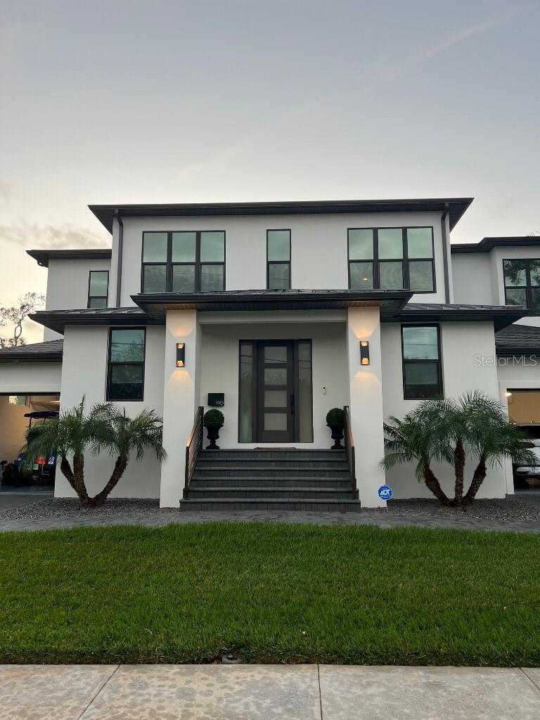 BEST GOLF COURSE SUNSET VIEW!  Located in the heart of Snell Isle, this property offers a vacation-like lifestyle while being just minutes from Downtown St. Pete’s vibrant dining, shopping, museums, and waterfront attractions.  Enjoy the mesmerizing view of the Vinoy Golf Course on the 17th hole safely set back with lush landscaping that affords privacy.  Designed by renowned architect, Daniel Currea Studio, and built by Milana Custom Homes, this luxury home boasts 3 spacious en-suite bedrooms upstairs, 2 bedrooms downstairs, a study, and a pool cabana bathroom.  The zen primary bedroom offers a sanctuary with seclusion from the other bedrooms, electric blinds, two walk-in closets, a luxurious bathroom, and a spacious balcony with panoramic views.  The home features an open floor plan designed to maximize golf course views complemented by beautiful flooring, exquisite millwork, hurricane impact windows, solid core interior doors, and designer lighting throughout.  Modern conveniences such as a large laundry room upstairs, LED lighting with dimmers throughout, a home water filtration system, reverse osmosis kitchen water faucet, living room fireplace, built in speakers connected to an indoor/outdoor sound system.  The gourmet chef’s kitchen showcases custom cabinetry, quartz countertops, Thermador appliances and a column wine fridge.  The kitchen connects to a mudroom with access to a large 2-car garage with plenty of storage and extra fridge/freezer.  A separate, 3rd garage bay is located on the other side of the home with a separate driveway.  All pavers (driveway and patios) have recently been power washed and sealed.   Behind the kitchen is a large pantry with plenty of counter space for kitchen appliances with a door to the outdoor kitchen area.  The spacious covered lanai is great for outdoor entertaining, TV viewing, grilling, and dining.  The saltwater heated pool with hot tub has LED lighting, a spacious sun shelf with a water feature all controlled by the Pentair Pool app.  Surrounding the pool area is a putting green, custom string lighting, and a gate to the golf course, which exhibits superb wildlife, mature landscaping, and amazing sunsets.  Enjoy expansive views of signature water holes 16, 17, and 18 manicured by The Vinoy Golf Club, which has been a certified Audubon Sanctuary since 2008.  This home is close to the new Whole Foods, and has cutting-edge technology including a SANUS AV Rack with a Denon AV receiver connected to several Sonos zones with ceiling speakers as well as a high-end ADT system with exterior cameras, Google Home, and a ring doorbell.  The property features a fully fenced-in yard with a beautiful Alexander palm surrounded by lush landscaping that provides privacy and serenity.  The irrigation system on reclaimed water and the upgraded dual HVAC units with UV lights to improve indoor air quality are very efficient.    This stunning home is the epitome of refined Florida living with no detail overlooked in design, function, or maintenance.