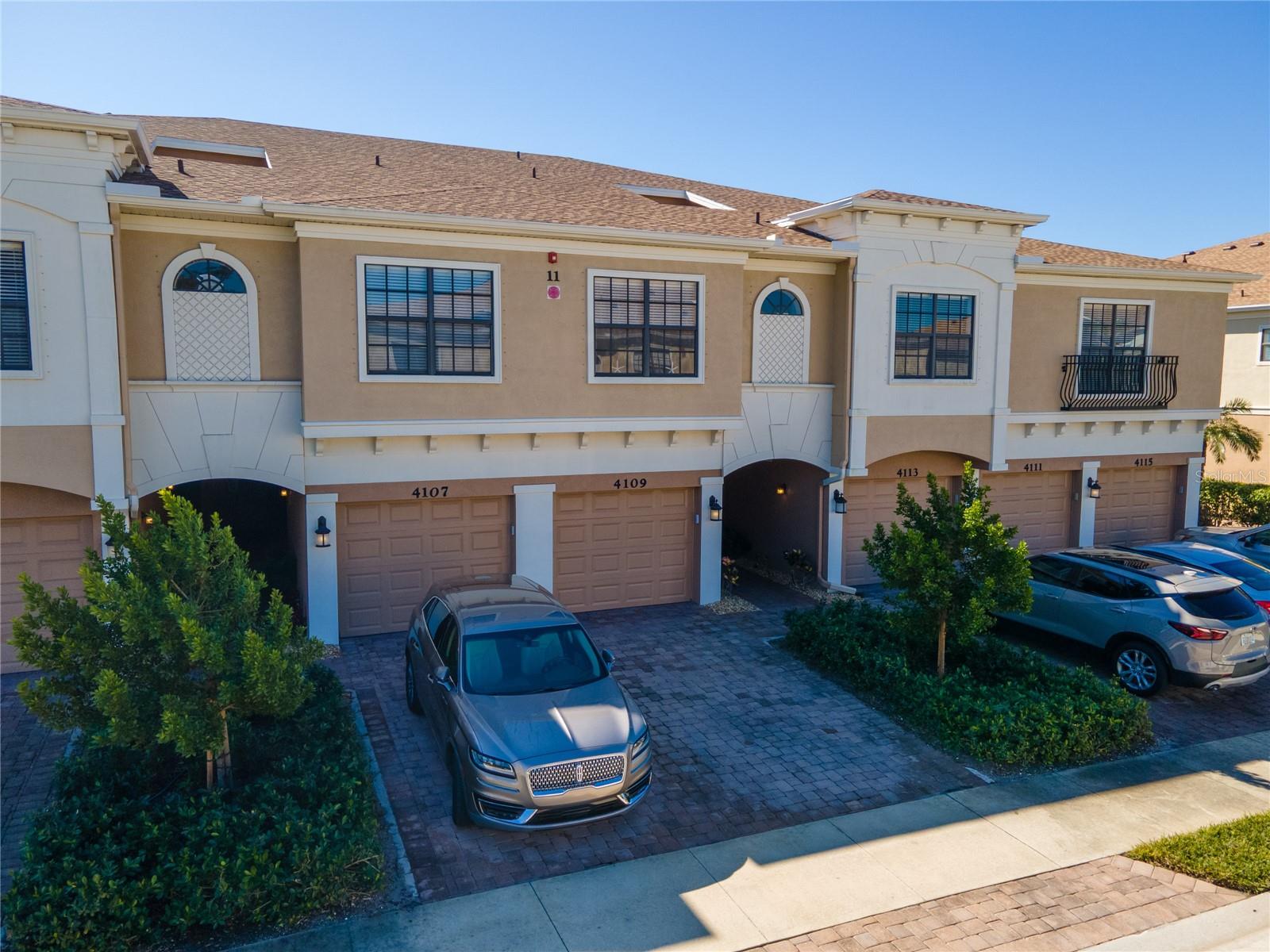 Located in the desirable community of Palma Sola Trace, this beautifully maintained two-story condo with an attached one-car garage offers a low-maintenance lifestyle just minutes from beaches, shopping, dining, IMG Academy, Robinson Preserve, and medical facilities. The popular Carlisle floor plan features a bright, open main level with spacious living and dining areas, a well-appointed kitchen with solid wood cabinetry, stone countertops, stainless steel appliances, and direct access to a private screened lanai, plus a convenient guest half bath. Upstairs, the primary suite offers a generous layout with en suite bath, accompanied by two additional bedrooms and a full bath. Recent updates include a new washer and dryer (2023), new furnace (2021), water heater (2024), garbage disposal (2024), and a new garage door (2025). Carpet was installed approximately three years ago and gently used, as the home has served only as the owners’ vacation residence and has not been rented. Hurricane shutters are stored in the garage for added peace of mind. Enjoy easy access to the community amenities, including clubhouse, fitness center, resort-style heated pool and spa, walking trails, and playground. The unit is conveniently located near the community gate for quick walks to shopping and dining, as well as close proximity to the trash and recycling area. Three-month rentals are permitted, making this an ideal full-time residence, seasonal retreat, or investment opportunity.