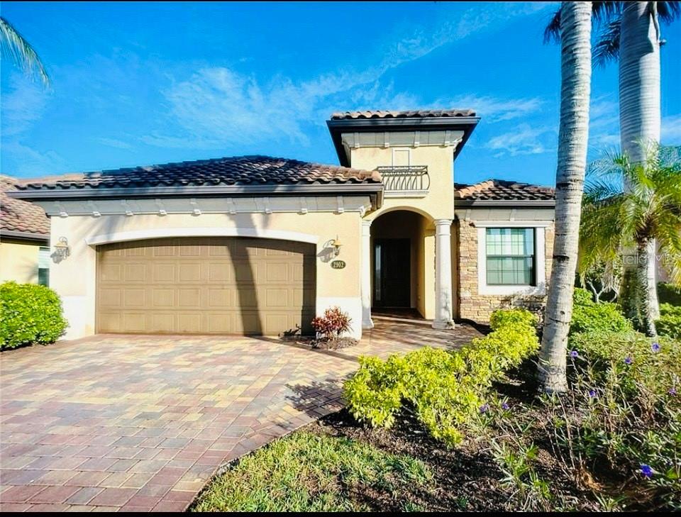 *EXTREMELY MOTIVATED SELLER, BRING ALL OFFERS* Welcome to this GORGEOUS picture-perfect home in the award-winning community of Fiddler's Creek!!! This move-in ready 2,247-square-foot beauty is a must-see as it has the BEST UNOBSTRUCTED WATER VIEWS in the entire community!!! This 4-bedroom, 2-bath home provides abundant space and natural light. The bright interior is beautifully decorated with neutral décor and features tray and volume ceilings, wainscoting, arched doorways, crown molding, and tile throughout. The great room layout seamlessly connects the open living area, dining area and gourmet kitchen which boasts granite countertops, gas cooking, pantry, stainless steel appliances and breakfast bar.  The master suite has  walk-in closets and en suite with dual sinks and vanities, walk in tile shower, separate soaking tub and enclosed water closet. Enjoy the sun filled days in your gas-heated pool with a BRAND NEW HEATER AND PUMP with a spa and entertain with ease on the screened lanai with a summer kitchen featuring a grill with vent hood. Mesmerizing views of the sun setting over long lake views from your large covered lanai with storm screens and soothe your senses in the heated pool and spa. The home is protected by impact-resistant glass windows and doors. Fiddler’s Creek offers world-class amenities including clubhouse, resort-style pool, fitness center, fine and casual dining, tennis, pickleball and optional golf, beach and marina memberships are available.