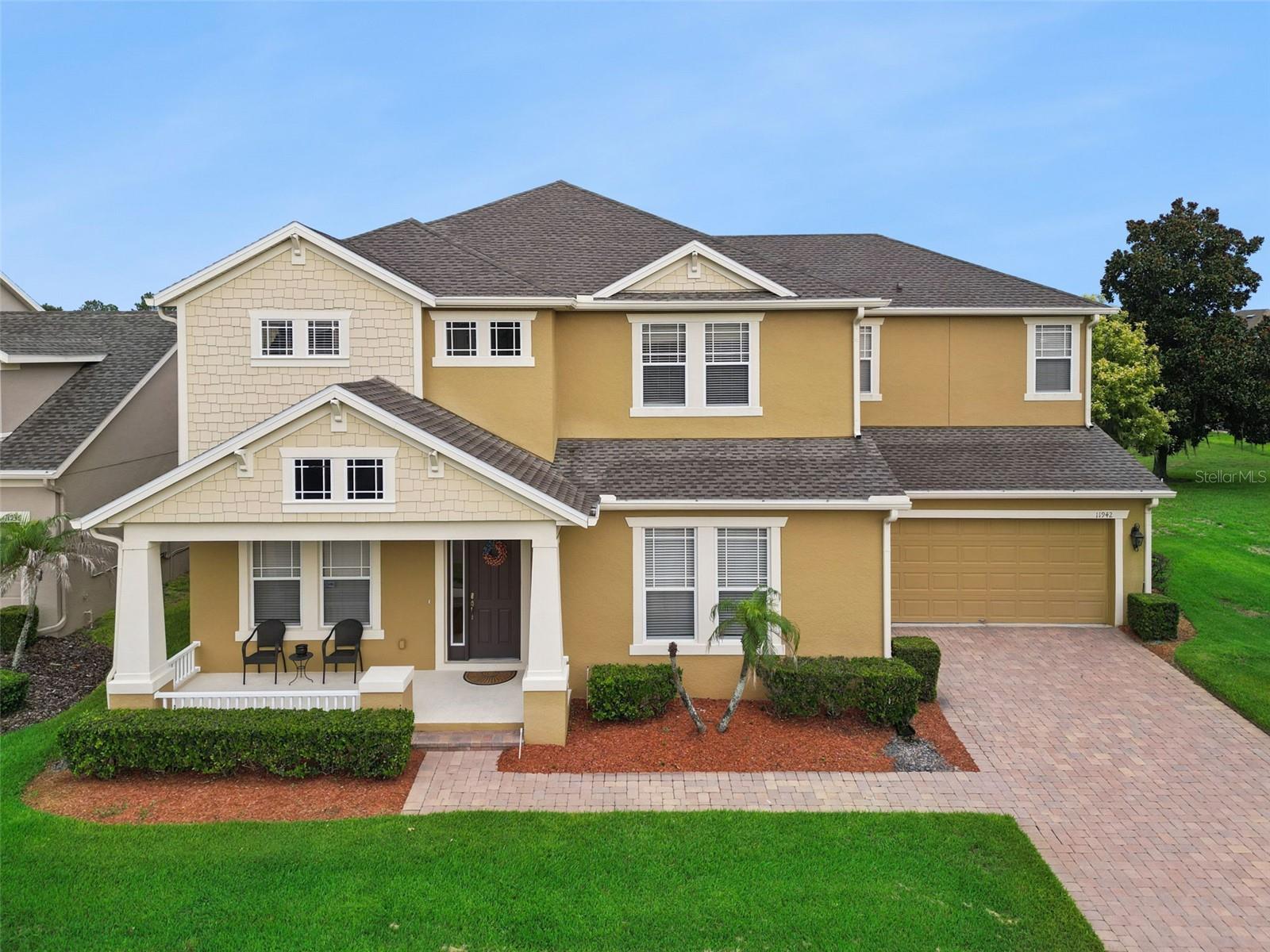 Never listed before, this beautifully maintained residence is located in Grande Pines, an intimate community of only sixty homes just 1 mile from Disney, Windermere, and Winter Garden — offering the rare opportunity to enjoy nightly fireworks from the comfort of your own backyard.

This exceptional 5-bedroom, 3.5-bath home blends modern convenience with the timeless appeal of a traditional family home. Thoughtfully cared for by one owner, the property features a split 3-car garage and a classic two-staircase design that enhances both flow and privacy. One staircase leads to three spacious secondary bedrooms, while the second provides a private entry to the upstairs primary suite — a layout reminiscent of traditional homes where separation and quiet retreat were key elements of design.

Inside, generous room sizes, walk-in closets, and designer window treatments evoke the warmth and character of a traditional home, while the true chef’s kitchen — complete with abundant cabinetry, stone counters, and double ovens — offers both charm and functionality. A flexible downstairs room (bedroom #5) serves perfectly as an office, playroom, craft room, or additional bedroom.

Storage is abundant throughout, including extensive under-stair storage, linen closets in every bathroom and bonus room, which reflects  the practical, built-in organization needed for busy family life.

Situated on a premium lot beside protected community space that will never be developed, the home offers a sweeping yard, peaceful views, and a private pool and spa overlooking a serene water vista. Recent upgrades include two new A/C units (2019), a fully rescreened pool enclosure (2020), new roof (2023), freshly painted pool decking and enclosure (2024), not to mention the whole house water softener and surround sound!

Located within Windermere’s top-rated school district and close to major highways, fine dining, and premier shopping, this home offers the perfect blend of traditional comfort, modern luxury, and the exclusivity of living in Grande Pines.