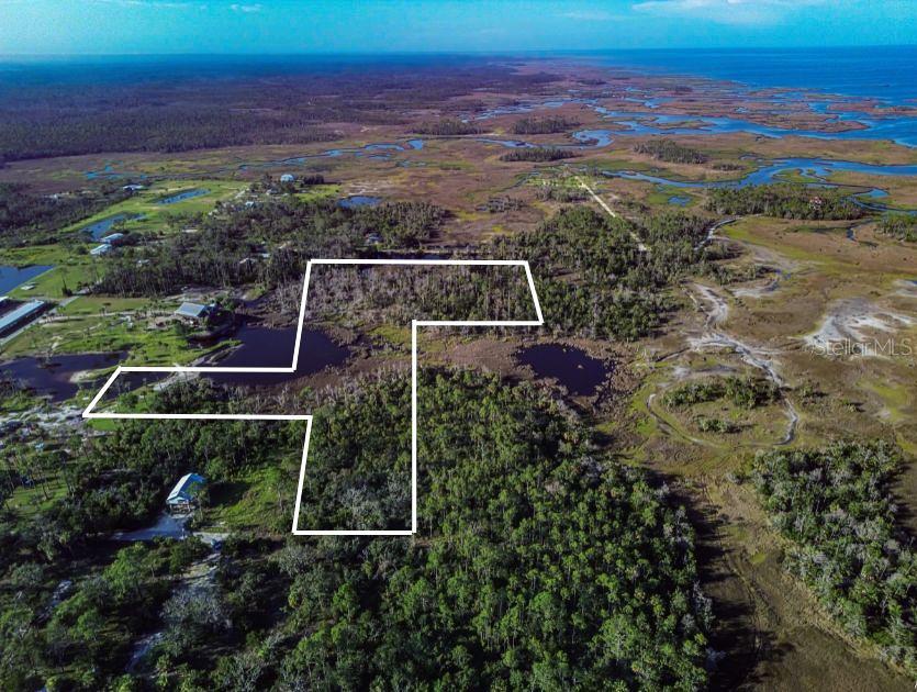 MOTIVATED SELLER! Rare 5-acre Steinhatchee homesite offering the perfect blend of buildable uplands and private wetlands that create a breathtaking, natural Old Florida backdrop. Tucked away in one of Florida’s most beloved coastal fishing communities, this property is your chance to design a dream coastal retreat, income-producing vacation rental, or private family compound surrounded by peace, privacy, and nature.
Steinhatchee is best known for its world-class fishing, legendary scalloping, and laid-back “Old Florida” lifestyle that draws visitors back year after year. Just minutes away, you’ll find local marinas, boat ramps, and waterfront restaurants where the day’s catch often ends up on your plate. Whether you’re looking to build now or invest for the future, this property offers a rare opportunity to enjoy the charm of a quiet coastal town with easy access to the Gulf, outdoor recreation, and a tight-knit waterfront community. All property information, including but not limited to zoning, buildability, wetlands, flood zones, and permitted uses, should be independently verified by the buyer with Dixie County.
