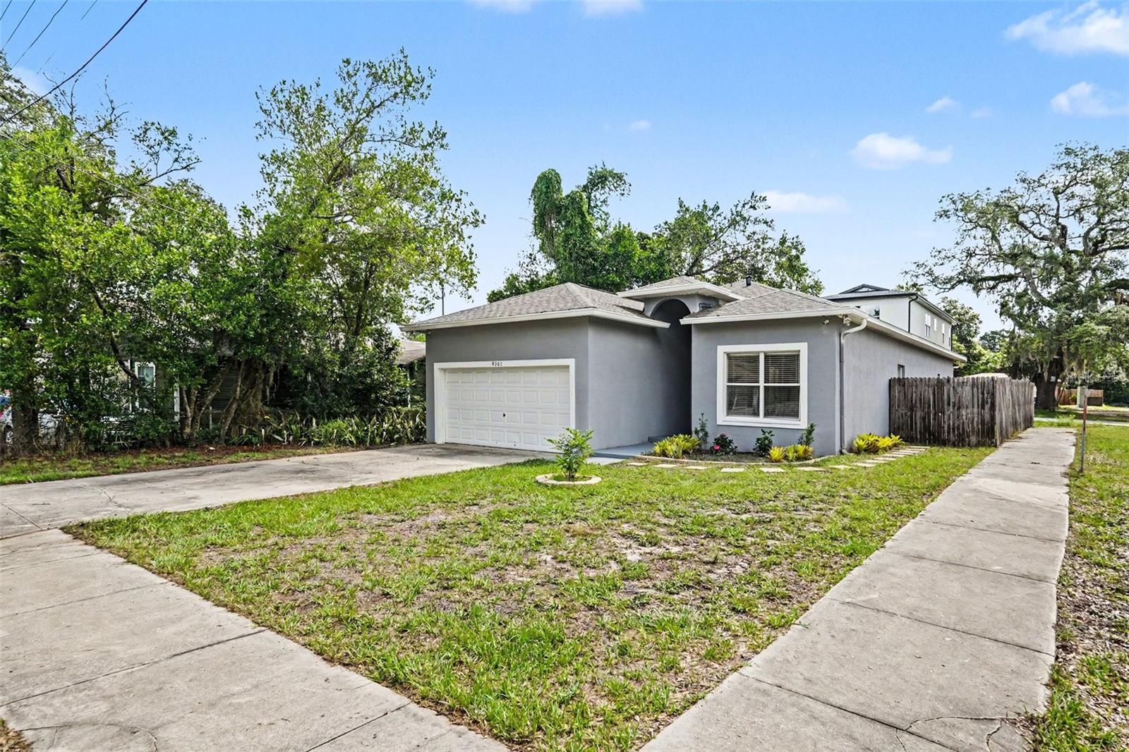 Looking for a clean, updated home with plenty of space and an unbeatable location? This beautifully maintained 3-bedroom, 2-bath, 2-car garage home is the perfect rental opportunity! Situated on a desirable corner lot in Tampa, this home offers a spacious, functional layout with modern updates throughout. Step inside to an inviting open floor plan featuring a generous living room, formal dining area, and a bright kitchen complete with abundant cabinet space, ample countertops, a breakfast bar, and a separate breakfast nook—perfect for everyday living or entertaining. The desirable three-way split bedroom floor plan provides added privacy, while the spacious primary suite features a walk-in closet, relaxing garden tub, and separate shower. Enjoy the peace of mind that comes with numerous recent upgrades, including a brand-new roof (2024), fresh interior paint, new carpeting, a beautifully remodeled guest bathroom, upgraded R-38 attic insulation for improved energy efficiency, and a Blue-Tube UV-X germicidal UV light system that enhances indoor air quality. Additional major improvements include a newer HVAC system, water heater, and updated kitchen and bathrooms. Outside, you'll appreciate the fully fenced backyard—ideal for relaxing, entertaining, or enjoying outdoor activities—as well as the oversized driveway and attached two-car garage offering plenty of parking and storage. Conveniently located just minutes from I-275, Downtown Tampa, major hospitals, shopping, restaurants, entertainment, and Tampa International Airport, this home offers the perfect combination of comfort, convenience, and value. Homes this well-maintained and updated don't stay available for long. Schedule your private showing today and make this beautiful Tampa home yours!