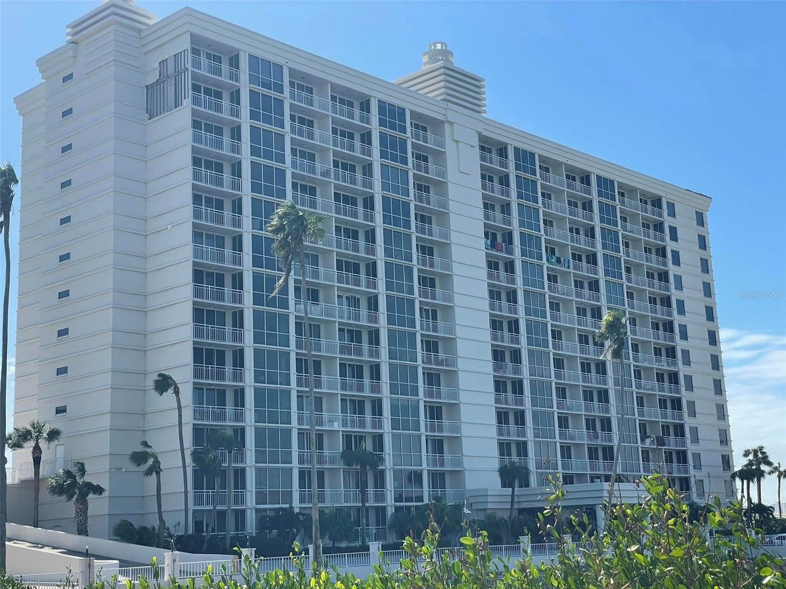 Virtually Staged. Experience breathtaking waterfront living from this spacious 2-bedroom, 2-bath residence in the highly sought-after 100 Pierce condominium in the heart of Downtown Clearwater. Priced at $600,000, this exceptional home offers approximately 1,435 square feet of living space and showcases panoramic views of Clearwater Harbor, the marina, and the Clearwater Memorial Causeway from multiple private balconies.

The thoughtfully designed floor plan features expansive living and dining areas filled with natural light, creating the perfect setting for both everyday living and entertaining. Floor-to-ceiling sliding glass doors frame the stunning water views and provide seamless access to generous outdoor living spaces where you can enjoy morning coffee, watch boats navigate the harbor, and take in spectacular Florida sunsets.

The kitchen offers granite countertops, abundant cabinetry, ample workspace, and a functional layout that opens to the main living areas. The spacious primary suite features direct balcony access, water views, a walk-in closet, and an en-suite bathroom. A generously sized guest bedroom also enjoys balcony access and beautiful waterfront vistas, providing comfort and privacy for family and visitors alike.

Offered unfurnished, this residence presents an outstanding opportunity for a new owner to personalize the space while enjoying one of Clearwater’s most desirable waterfront locations.

Residents of 100 Pierce enjoy a resort-inspired lifestyle with a waterfront pool and spa, fishing dock, kayak and paddleboard storage, clubhouse, barbecue grilling area, covered parking, and secure building access.

Ideally located in the heart of Downtown Clearwater, just moments from The BayCare Sound at Coachman Park, waterfront dining, shopping, entertainment, and world-famous Clearwater Beach, this residence offers the perfect combination of location, views, and lifestyle. Enjoy easy access to concerts, festivals, community events, and the vibrant waterfront atmosphere that has made Downtown Clearwater one of Tampa Bay’s most exciting destinations.

Highlights Include:

• 2 Bedrooms | 2 Bathrooms
• Approximately 1,435 Sq. Ft.
• Multiple Private Balconies
• Panoramic Marina and Harbor Views
• Granite Countertops
• Walk-In Closet in Primary Suite
• Floor-to-Ceiling Sliding Glass Doors
• Covered Parking
• Waterfront Pool & Spa
• Fishing Dock
• Kayak & Paddleboard Storage
• Clubhouse & Barbecue Grills
• Minutes to Clearwater Beach and Downtown Clearwater

Discover the rare opportunity to own a waterfront residence with spectacular views, generous living spaces, and an unbeatable Downtown Clearwater location.