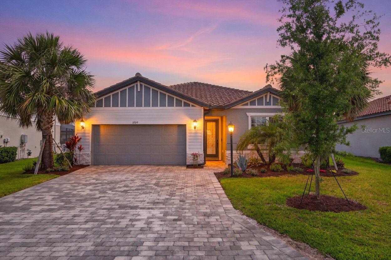 Welcome to 3709 Savanna Palms Ct in Bradenton—a STUNNING, move-in ready home built in 2023 that perfectly blends modern luxury, energy efficiency, and RESORT-STYLE LIVING. This 4-bedroom, 3-bathroom home sits on a premium lot with beautiful water views and offers over $100,000 in high-end upgrades with absolutely no detail overlooked. Step outside to your private backyard oasis featuring a BRAND-NEW HEATED SALTWATER POOL AND SPA, COMPLETE WITH WIFI CONTROLS, SCREEN ENCLOSURE, a safety fence, and water alarms for added peace of mind. Enjoy true Florida living just 30 minutes from the WORLD-RENOWNED beaches of Siesta Key Beach. Inside, the home is designed for comfort and convenience with smart and efficient features throughout. The climate is perfectly managed with a humidity-controlled thermostat and a Broan whole-home dehumidifier, while a whole-home air purification system with ionization ensures exceptional indoor air quality. Spray foam insulation enhances energy efficiency, and a WHOLE HOME GENERAC NATURAL GAS GENERATOR provides reliable backup power. The kitchen is equipped for both everyday living and entertaining, featuring a gas stove and modern finishes, while the tankless water heater ensures endless hot water. The primary suite includes custom built-ins in the master closet, offering both style and functionality. ADDITIONAL UPGRADES include a WATER SOFTENER system with REVERSE OSMOSIS and mineral enhancement, WIFI-CONTROLLED IRRIGATION, a FULLY FENCED yard, and an EXTENDED DRIVEWAY for added convenience. This home truly offers zero compromise—combining LUXURY FINISHES, cutting-edge systems, and a PRIME LOCATION near some of the BEST BEACHES in the country. If you're looking for piece of mind with a NEWER CONSTRUCTION home that’s fully upgraded and completely turnkey, this is the one!