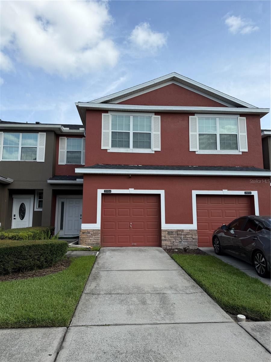Short Sale. Welcome to 2914 Rodrick Circle, Orlando, FL – A Spacious and Stylish Townhome in a Prime Location! This beautifully maintained two-story townhome offers the perfect combination of space, comfort, and modern updates. Featuring an open and inviting floor plan with rich wood flooring throughout the main living areas and upstairs, this home is move-in ready and designed for both everyday living and entertaining. The spacious kitchen is the heart of the home, showcasing granite countertops, stainless steel appliances, abundant cabinetry, and plenty of prep space for cooking and gathering. The adjacent dining and living areas provide a seamless flow, while sliding glass doors lead to a screened lanai and private backyard space—perfect for relaxing outdoors without rear neighbors directly behind you. The first floor also includes a convenient half bath and a flexible front room ideal for a home office, formal living room, or playroom. Upstairs, you'll find generously sized bedrooms, a spacious loft that can serve as a second living area, media room, or home workspace, and beautifully updated bathrooms. The primary suite offers a peaceful retreat with an upgraded en-suite bath featuring modern finishes, dual vessel sinks, and a large walk-in tiled shower. Located in a well-maintained community with sidewalks, mature landscaping, and easy access to major highways, shopping, dining, schools, and Orlando attractions, this home provides both convenience and value. Whether you're a first-time buyer, growing family, or investor, this spacious townhome is an opportunity you won't want to miss.