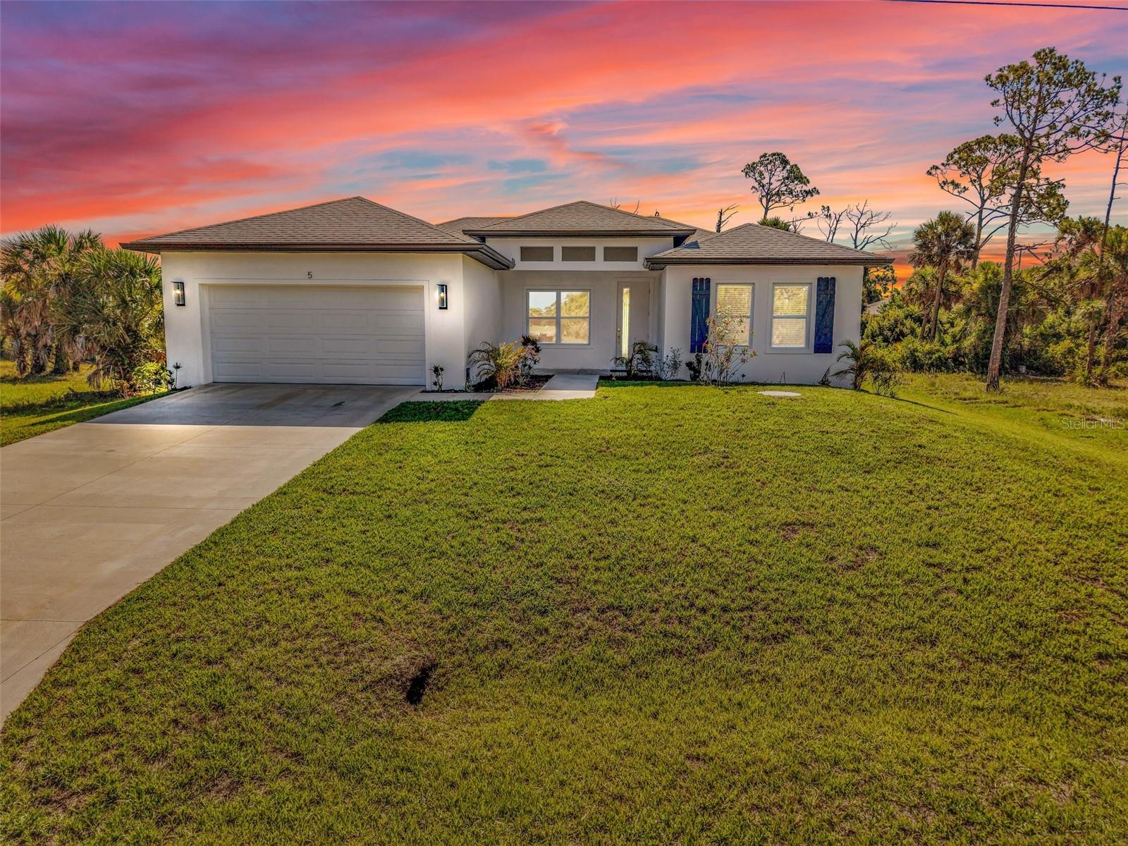 Welcome to 5 Mate Dr, a brand-new custom-built home with just under 1700 square feet of living space, offering the perfect blend of modern design, coastal convenience, and peaceful Florida living. This 4-bedroom, 2-bathroom residence features a bright open-concept floor plan with abundant natural light, quality finishes, and a seamless flow ideal for both everyday living and entertaining. The spacious primary suite serves as a private retreat with dual walk-in closets and a spa-inspired walk-in shower. Built with durable concrete block construction and impact-rated windows, this new home provides energy efficiency, low-maintenance ownership, and added peace of mind. Nestled in the quiet surroundings of Placida with fewer neighboring homes, this property offers a rare sense of privacy and tranquility while remaining just minutes from some of Southwest Florida's most sought-after destinations. Enjoy easy access to multiple Gulf beaches, including Boca Grande, Englewood Beach, Blind Pass Beach, and Manasota Key, making beach days, boating adventures, and sunset walks part of your everyday lifestyle. World-class fishing, championship golf courses, waterfront dining, marinas, and the natural beauty of Charlotte Harbor are all nearby. Whether you're looking for a primary residence, seasonal retreat, or investment opportunity, this exceptional new construction home delivers the coastal lifestyle buyers seek—without the premium price tag often associated with new homes near the water. Don’t forget to check out the 3D Virtual tour and floor plan, then contact your favorite real estate agent to see this wonderful home in person!