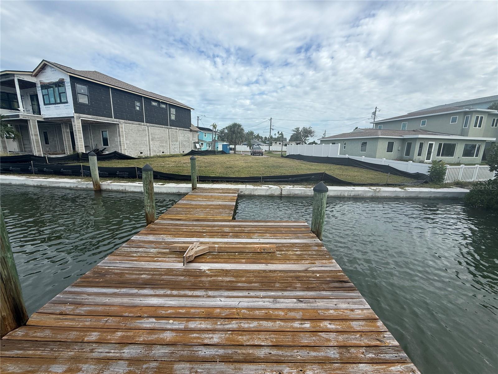 PRICE TO SELL.   WATERFRONT LOT WITH 83 FEET OF SEA WALL installed August 2024 at a cost of over $34,000. This lot has been cleared and is ready for new owners to come build their dream home.   Come live the coastal lifestyle in the heart of Madeira Beach. This property features 83 ft of waterfront and private dock (appx 300 sq feet). When approaching this property take note of the peaceful surroundings on this quiet cul de sac.  Enjoy front row seats to the annual boat parade, fourth of July firework as well as watching dolphins and manatees play.  This boaters paradise is is about a 15 minute boat ride  from your dock to the gulf via Johns Pass.  A short walt to the sugar sands of Madeira Beach and a 10 minute drive to Johns Pass Village. Do not miss this opportunity to build your dream beach home and experience waterfront living at its finest,