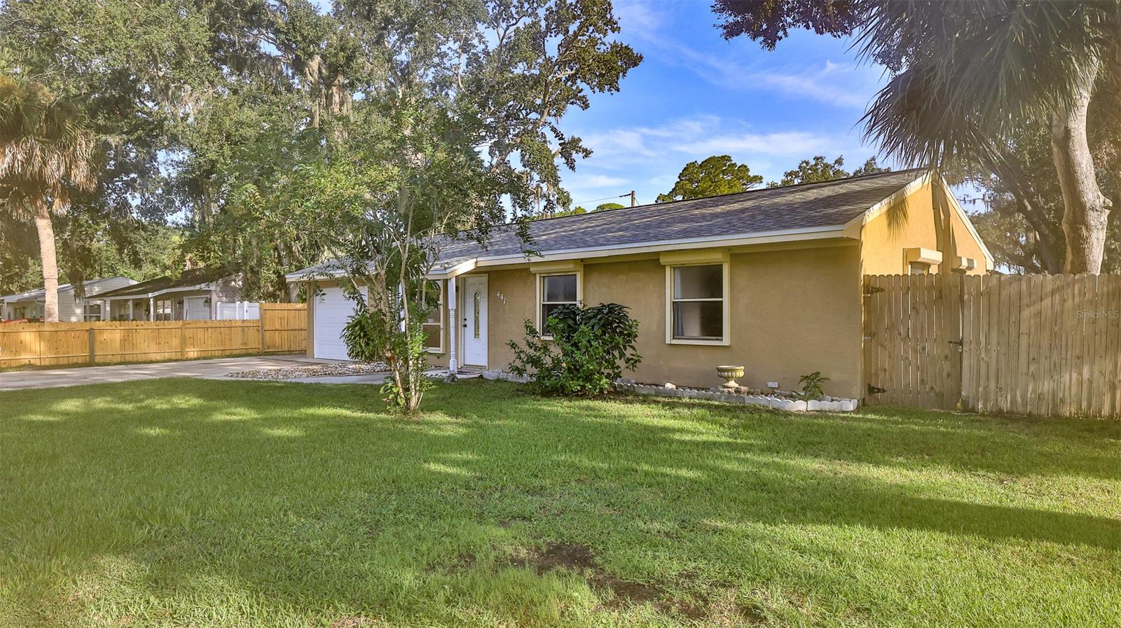Back On The Market! Buyers Financing fell through! Perfect PORT ORANGE POOL HOME with a front yard Lake View! NEW ROOF! NEW A/C! NEW Water Heater! Move right in and enjoy this 3 bedroom, 2 bath home with garage and extra parking pad for RV/Boat, toys and NO HOA! Tastefully decorated interior, spacious kitchen and Florida Room with mini bar & pass through window to the patio! Impressive detail & wood work additions throughout! Newer lighting fixtures, fresh interior paint, & new disposal. Relaxing, screened in pool with covered patio area for grilling. New wooden bar area with sink. Back yard is fully fenced, with new bamboo planted for extra privacy! New pool filter, light & Impeller. Garage has new window A/C & door. Convenient Location East of I95, 12 minutes to the beach! Quick Close! Area of sought after Schools, Medical, Shopping, Restaurants & Dog Park! Zoned for Spruce Creek Elementary, Creekside Middle & Spruce Creek High School. ;Water: City
