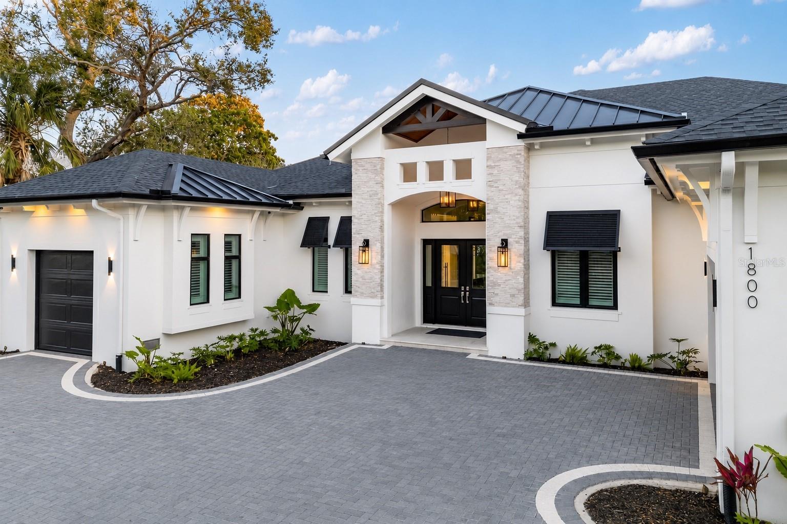 Nestled in the heart of West of the Trail, this luxury single-story estate represents the pinnacle of modern living. Encompassing 3,262 square feet, the home features 4 bedrooms, 4 full bathrooms, and 2 half baths, all thoughtfully designed for both comfort and functionality. Set on an expansive 15,930-square-foot lot, the residence offers tranquility just moments from the shops and dining of Southside Village. Enjoy the convenience of a circular driveway with a custom paver design and garage space for three cars. With striking architecture, impeccable craftsmanship, and beautiful, thoughtfully curated finishings—showcasing detailed trim work and refined design throughout—this residence delivers sophistication and all-inclusive resort-style living in one of the area’s most desirable locations.

Inside, soaring 18-foot vaulted ceilings and custom tray ceilings enhance the open-concept layout, while 12-foot full pocket sliders seamlessly connect indoor and outdoor living spaces. The living room is anchored by a sleek fireplace, creating a warm yet modern focal point. The chef’s kitchen is equipped with professional-grade gas appliances, a waterfall-edge quartz island, custom cabinetry, and an expansive butler’s pantry for effortless entertaining. A glass-enclosed wine display and tray ceiling details add dramatic appeal. The primary suite features 14-foot ceilings and a spa-inspired bath with a freestanding soaking tub, dual vanities, and a luxurious walk-in shower. All bedrooms include custom California Closets. A designated large office, spacious laundry room, and private gym complete the interior amenities. The home also has a full security system installed.

Outdoors, the resort-style backyard showcases a heated saltwater pool and hot tub spa with elegant water features. The back patio, finished with a Brazilian hardwood ceiling, is enhanced with remote-controlled mosquito blinds with sun protection for year-round comfort, as well as a full sound system that can be app controlled. A fully equipped outdoor kitchen, fire pit, and outdoor SunBrite TV create the ultimate entertaining space, while a private putt-putt golf course adds a one-of-a-kind touch to this exceptional property.

Please let us know how we can help and give us a call to set up a tour of this beautiful home. Thank you.