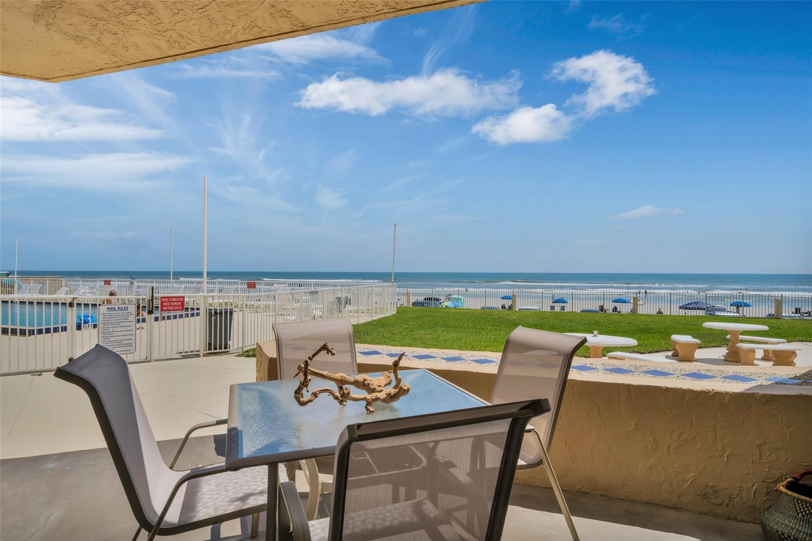 Short term rentals approved! Perfect investment property - STUNNING VIEWS, PRIME LOCATION! Located on the first floor with access to the large community pool, courtyard and beach access. This beach front 2 bedroom 2 bathroom has a breathtaking view of the ocean and is only a few minutes from Flagler Avenue for shopping, dining & night life. Lovingly maintained and only visited periodically, the condo is in great condition. BRAND NEW AC Installed June 2023. With recently serviced slider doors, fresh paint and tile throughout it's ready for immediate occupancy. Book your showing today & have a chance to enjoy all the fun and serenity New Smyrna Beach has to offer. All information recorded in the MLS intended to be accurate but not guaranteed, buyers agents to verify all information deemed important to them. ;LocationDescription: Condo ;Water: City
