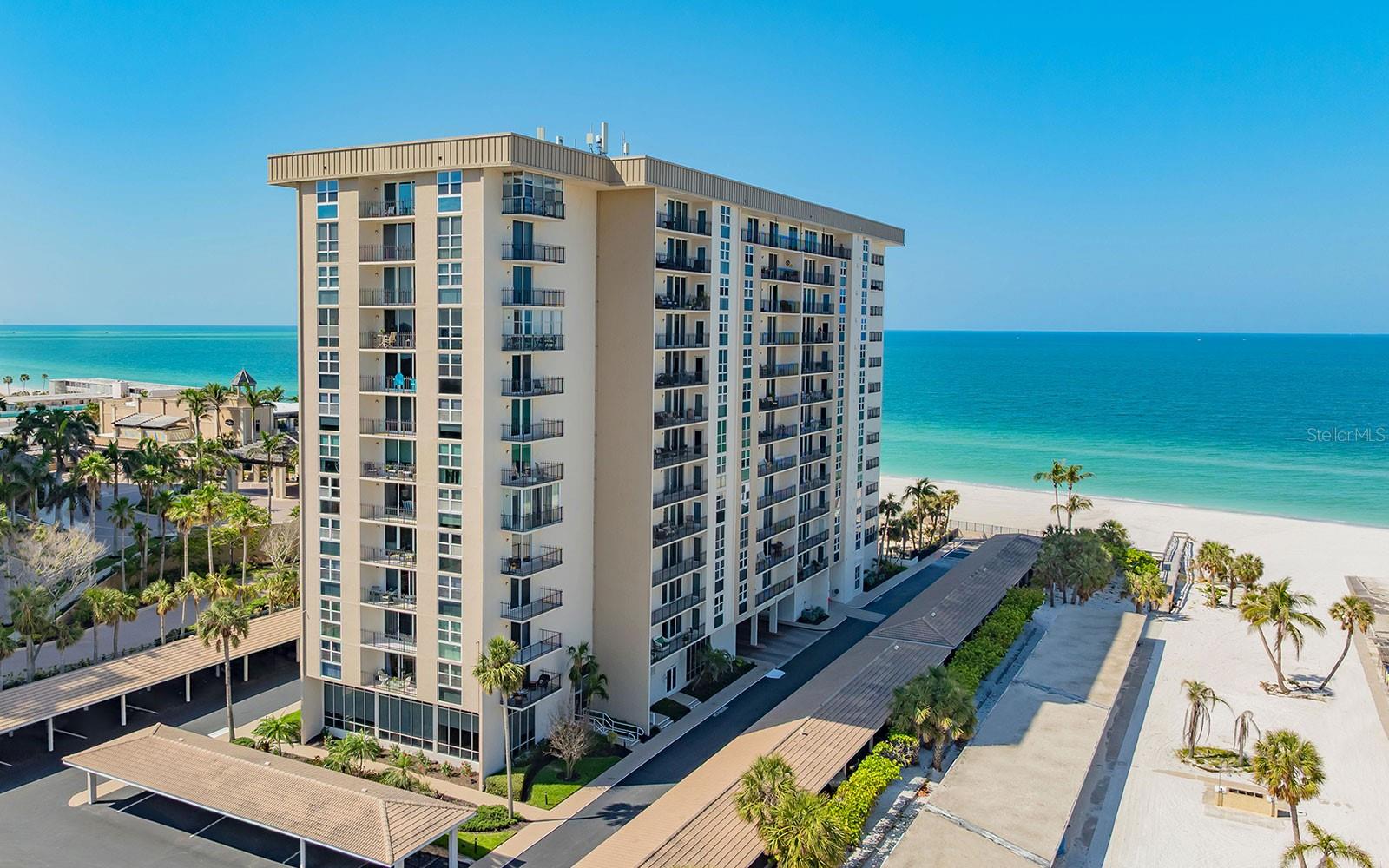 Live each day surrounded by blue skies, turquoise Gulf waters and Sarasota’s celebrated sunsets. Tucked at the south end of Lido Key, this beautifully remodeled residence offers a relaxed beachfront setting just moments from St. Armands Circle and downtown Sarasota. The open floor plan is bright and welcoming, with contemporary finishes and a layout designed to make the most of natural light. The remodeled kitchen features sleek white cabinetry, quartz countertops and a clean, coastal-modern style. The spacious bedroom opens to the covered balcony, and includes a walk-in closet and en-suite bath, creating a comfortable private retreat. Gulf views from the balcony bring added beauty to daily living and enduring appeal to this beachside home. Climate-controlled storage and one covered parking space add convenience. Lido Beach Club is a professionally managed community with amenities that enhance the beachfront experience, including a heated pool with tiki seating areas, gated beach access, serenity garden, fitness room and social room for private gatherings. Excellent location with the beach at your backyard, South Lido Park nature preserve across the road, the Ritz Tiki Beach Bar next door, one mile to world-famous St. Armands Circle, and only four miles to downtown Sarasota. Ride the complimentary Lido Shuttle to and from St. Armands Circle, or the Sarasota Bay Runner trolley to downtown destinations. Life is good at the beach!