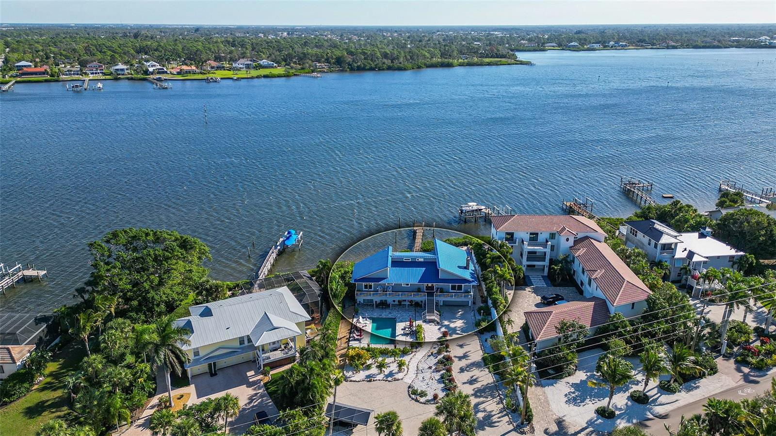 Embark on the ultimate coastal living experience with this extraordinary Manasota Key residence, a haven perfectly suited for singles, families, multi-generational living, or astute investors. Nestled along the Bayfront with exclusive deeded beach access, this unique property boasts four bedrooms and four and a half bathrooms. What distinguishes this home is its innovative design, featuring two distinct residences under one roof, each with private entrances. Whether utilized as a cohesive home or divided for in-laws, teenagers, the flexibility is unparalleled. Recently renovated in 2021, the interior showcases contemporary sophistication with upgraded cabinetry and appliances in both kitchens. The main-level kitchen boasts breathtaking granite countertops, while the lower-level kitchen showcases stunning quartz. Architectural details such as vaulted ceilings with beam accents, a captivating fireplace, and exquisite lighting contribute to the home's distinctive charm. Newer installed hurricane windows and sliders, except one equipped with a hurricane shutter, ensure durability and security. Step outside to your private dock, featuring a 10,000 lb. lift installed in 2022, water, and electric connections. The metal roof, replaced in 2020, enhances the home's resilience. Porcelain tile graces the main level, while the lower-level features beautiful tile. Bathrooms are adorned with beautifully tiled showers and upgraded fixtures. The master bedroom on the main floor is a true sanctuary with an en-suite featuring a walk-in shower and a jetted bathtub for two. Expansive living spaces on both floors offer breathtaking views from every window or slider. Outdoor living is elevated with decks running the length of the house, a spacious paver patio hosting a firepit, bocce ball court, and areas for kayaks and grilling. The resort-style pool with a sunbathing ledge and adjacent tiki bar creates an entertainer's haven. This meticulously maintained property includes a two-car garage, ample storage, and guest parking. Positioned on the Intracoastal with deeded Gulf of Mexico access, relish the best of both worlds—spectacular sunrises, sunsets, and a private entrance to the beach. Zoned as a two-family dwelling, this property presents endless opportunities. Witness dolphins play, observe manatees, and enjoy the convenience of two bridges to the island for mainland shopping. Your waterfront retreat awaits—call today for comprehensive details and to arrange your exclusive tour.