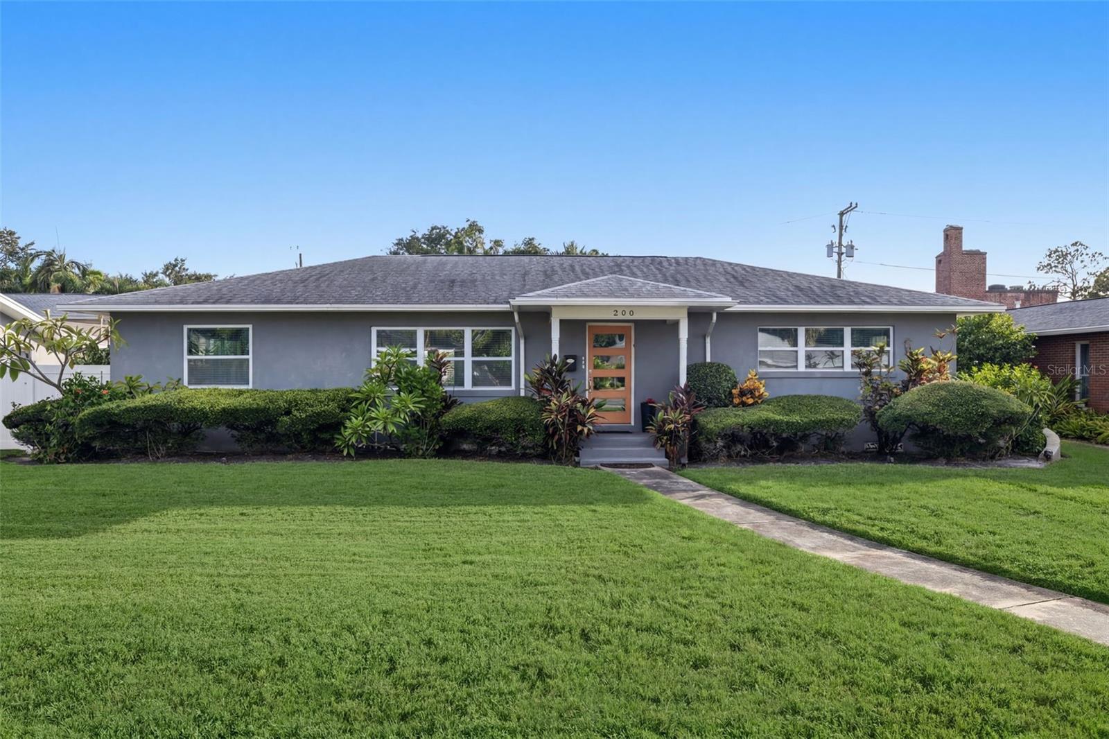 Virtually Staged. Welcome to one of St. Petersburg’s most sought-after neighborhoods, ideally located just minutes to the Gulf beaches and offering a straight drive down Central Avenue to vibrant downtown St. Pete. This beautifully updated mid-century block home sits along picturesque brick-lined Historic Park Street N, just one block from the Intracoastal Waterway, Sunset Park, and only a few blocks to the Elbow Lane public boat launch—perfect for kayaking, jet skiing, or boating. This home has been extensively upgraded throughout, featuring newer electrical (including panel, breakers, full wiring, and tamper-proof outlets), a newer 3-ton 14 SEER RunTru (Trane) heat pump, hurricane-impact windows, and a full re-plumb with updated fixtures. Inside, you’ll find a bright open floor plan designed for entertaining, complemented by recessed lighting, designer fixtures, ceiling fans, and engineered wood-look flooring throughout. The kitchen is a standout with Samsung appliances, white cabinetry with crown molding, glass display cabinets, granite countertops, a large breakfast bar, glass tile backsplash, and a convenient microwave drawer. Both bathrooms have been tastefully renovated with granite vanities, marble tile showers, and glass enclosures. The primary suite offers a private retreat with a custom walk-in closet system designed and installed by ClosetsByDesign, glass barn doors, and a striking stone accent wall with a built-in fireplace for added ambiance. A split floor plan provides oversized guest suites, each with generous closet space and built-ins. Natural light fills the home through abundant windows, complemented by neutral tones and high-gloss white trim. Step outside to your fully fenced backyard oasis featuring vinyl fencing with three gates, a large Trex deck ideal for entertaining, a fire pit area, and space for outdoor dining. The professionally upgraded landscaping ($5K) and reclaimed irrigation system enhance the setting, with ample room to add a private pool if desired. Enjoy stunning sunsets from your yard or take a short stroll to the waterfront park on Sunset Drive. Additional highlights include a spacious one-car garage with epoxy flooring, overhead storage, side entry door, garage refrigerator, electronic opener, and keypad entry. The home also offers rear alley access with a private driveway on a brick-paved street. No HOA, no CDD, and located on the edge of a flood zone—this property did not experience interior flooding during Helene (garage only had minimal water), and an assumable flood policy is available. Conveniently located near Tyrone Square Mall, Walter Fuller Park & Recreation Center, tennis courts, and a public pool. Bike, walk, or golf cart to Treasure Island for a perfect beach day.
Where else can you find this level of quality, location, and lifestyle at this price? Call today if you are ready to start living the Florida lifestyle and have your own slice of paradise!