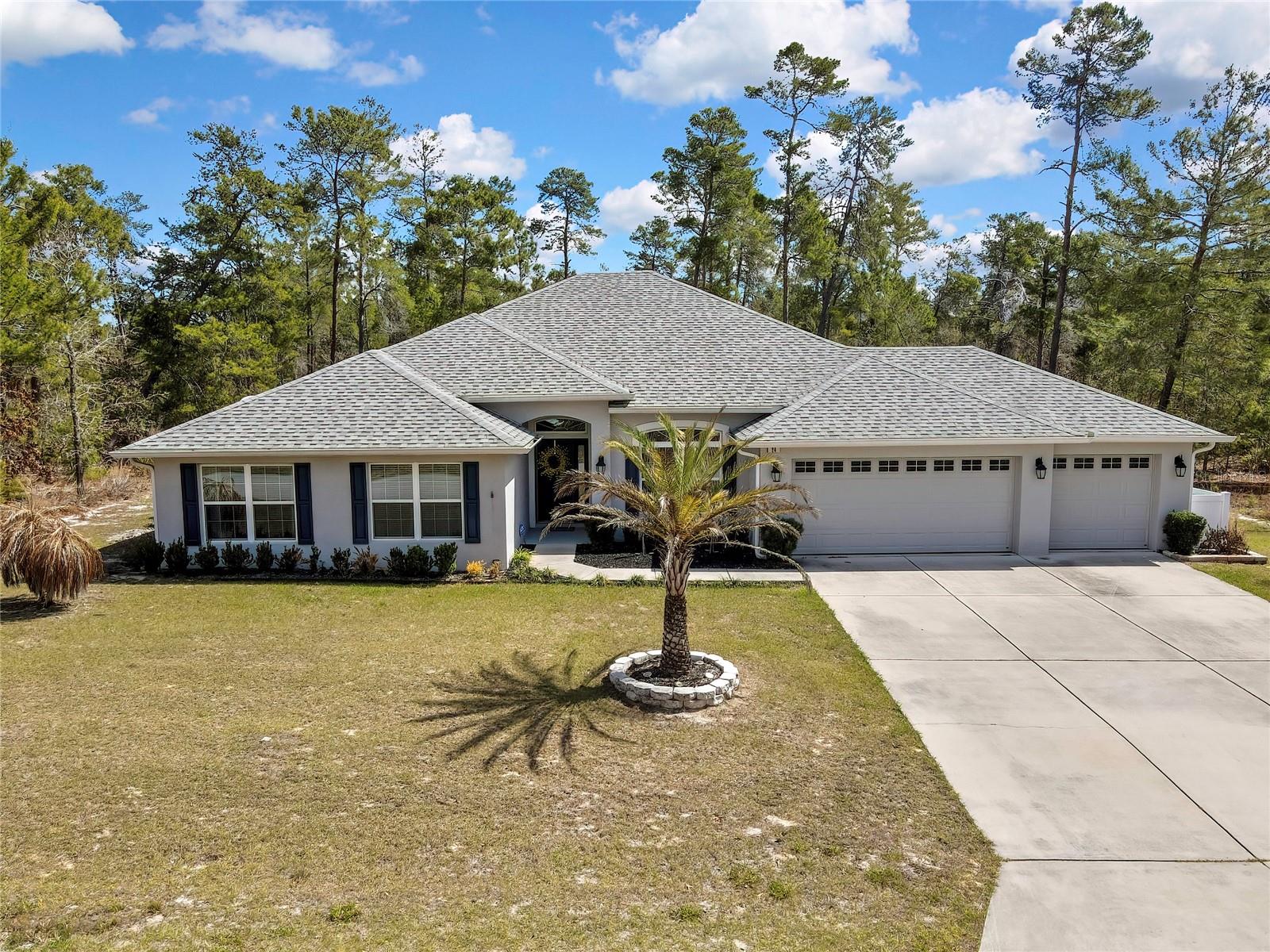 Discover this beautifully maintained 4-bedroom, 3-bath home located in the highly desirable Sugarmill Oak Village community. Built in 2020, this home showcases exceptional care and pride of ownership, offering modern comfort with a thoughtfully designed layout for both everyday living and entertaining. The spacious chef-inspired kitchen is the heart of the home, featuring stainless steel appliances, a large center island with granite countertops, and a generous walk-in pantry providing ample storage. The primary suite offers a relaxing retreat with an expansive ensuite bathroom that includes dual vanities, a soaking tub, a separate walk-in shower, and large walk-in closets. Step outside to the screened-in lanai, for unwinding in the evenings while enjoying the tranquility and privacy of the backyard. An oversized garage provides plenty of room for vehicles, storage, and hobbies. Conveniently located just minutes from the Suncoast Parkway, this home offers easy access to nearby amenities while maintaining the peaceful charm of the Sugarmill community. 
Close