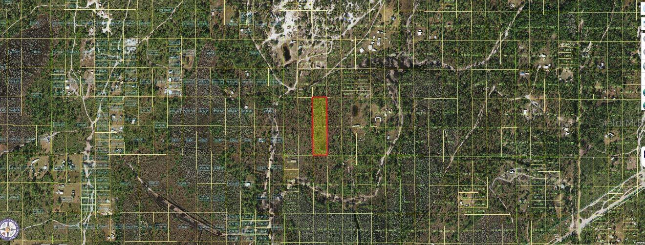2.48-acre vacant  lot located on Holopaw Groves Road in St. Cloud, Florida 34773.  "Zoning: OAC" Offering a generous amount of space and a peaceful rural setting, this property provides the perfect canvas for a custom spot with room for outdoor living areas,  or additional structures. Whether you're planning a secluded a solid land investment, this versatile parcel presents outstanding potential.Pin Location: Latitude 28.30440554 , Longitude -81.42218871. Note: buyers I emphasize the importance of conducting thorough due diligence to ensure that the property meets your expectations and requirements.