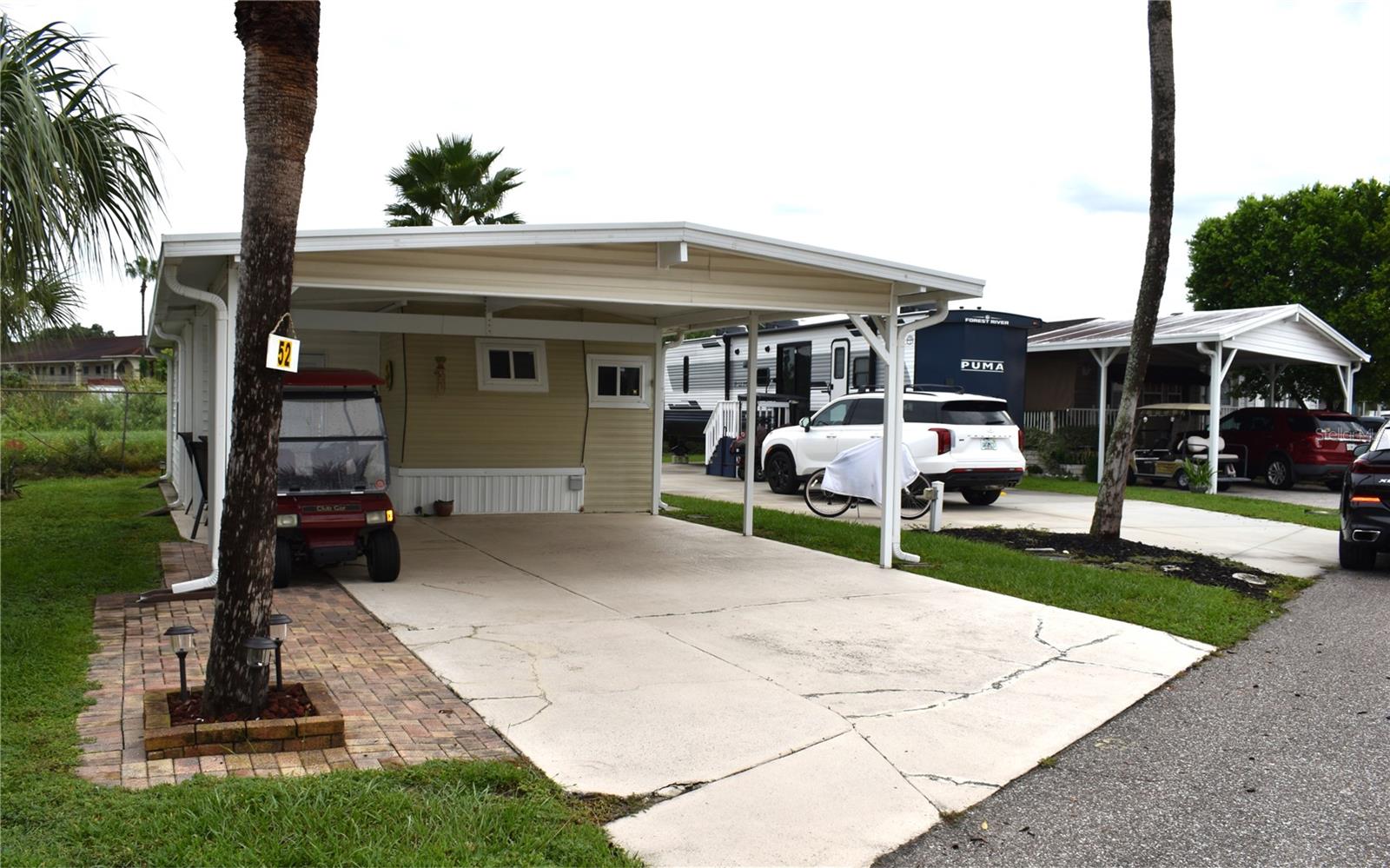Price Reduced!!!! 1 bedroom, 1 bathroom home located in the beautiful Outdoor Resorts at Orlando community! This perimeter lot offers added privacy with no rear neighbors. Features include a long driveway with covered parking. New fridge! CASH ONLY sale. Enjoy resort-style amenities including lake access, golf, shuffleboard, a community center, and much more. Conveniently located near Disney, shopping, and dining. Don't miss this opportunity to own in a gated, well-maintained community!