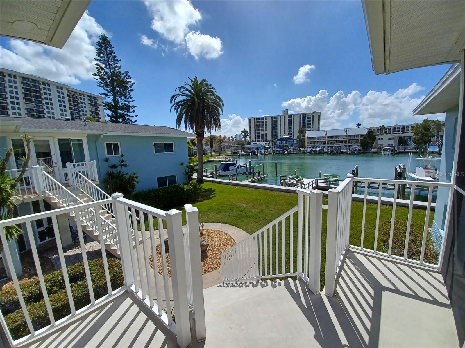 BIG PRICE REDUCTION.OWNER SAID SELL IT NOW. We will look at reasonable offers. Island Estates waterfront condo with boat docks on site (not available at this time), private garage and handy separate storage unit. Property includes 2 free on-site community laundry facilities. Located on a quiet cul-de-sac, take this opportunity to live in this beautifully located neighborhood.  Very spacious brightly lit living/dining room combination, with kitchen passthrough featuring Granet counter tops for serving and entertaining. Condo has two bedrooms with the spacious master on-suite offering a Jacuzzi tub. Just installed on 5/20/26. Brand New compressor and air handler. Living room features sliding glass doors to your large private screened patio with a beautiful water view overlooking the newly renovated docks and deck (boat slips for rent when available).  Property features a newly constructed seawall.
The Island Estates community is comprised of all the necessary conveniences such as grocery, restaurants, banking, gas station, UPS, shops and other services.  An added convenience is the Jolley Trolley, which provides daily service to the local beaches. Live in this beautiful waterfront community. THIS IS A RARE OPPERTINITY. DON,T MISS IT!!!