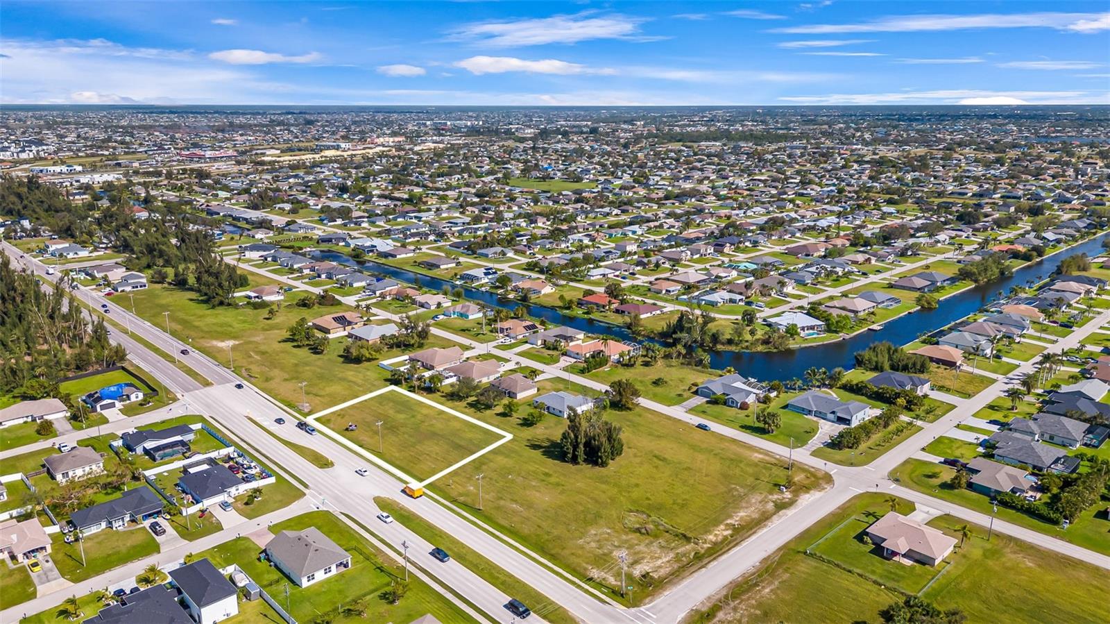 Prime commercial lot with over 200 feet of high-visibility frontage on Chiquita Blvd., just south of the rapidly expanding Pine Island Road commercial corridor. Zoned C – Commercial with a Commercial Professional (CP) future land use designation, this property offers outstanding flexibility for a wide range of high-demand business uses. Permitted options include professional and medical offices, retail, restaurants, assisted living, educational facilities, day care centers, and financial institutions — positioning this site as a versatile investment in one of Cape Coral’s fastest-growing areas. In addition to providing further value, the seller already has complete architectural plans for a two-story commercial building with reception, showroom, offices, conference rooms, and storage, enabling a buyer to move quickly from acquisition to development, saving significant time and cost in the planning process. The site is not in a flood zone and is served by city water and sewer, providing essential infrastructure and peace of mind for future development. Whether you’re planning a community-focused business, professional services hub, or high-traffic retail destination, this property delivers the zoning, utilities, and development-ready plans to bring your project to life. Don’t miss this rare opportunity. Owner financing is available—competitive terms for qualified buyers.