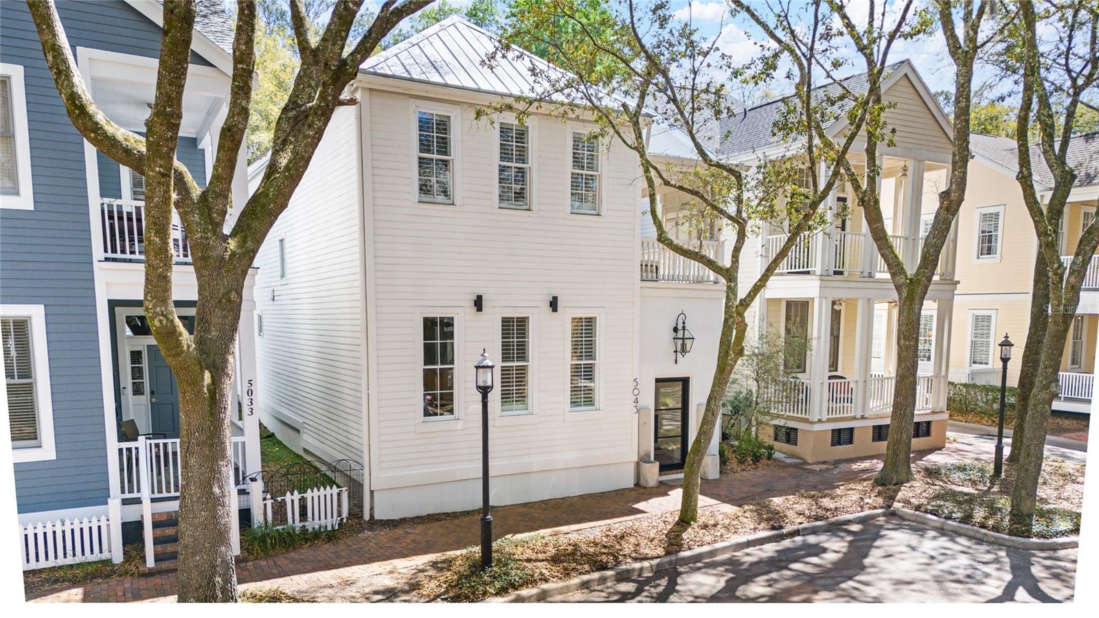 Incredible Rental Property! 2/2 Main House rents $3,500/month and 1/1 Apartment Rents $2500/month. Discover this beautifully updated 2025 Charleston-style home located in the heart of Haile Village Center. The property includes 2 bedrooms and 2.5 bathrooms in the main residence, plus a private 1 bedroom, 1 bathroom carriage-style apartment with a full kitchen and separate entrance—ideal for extended family, guests, or generating additional rental income. Whether you’re looking for a primary residence with flexibility or an investment opportunity, this home offers versatile living options and excellent rental potential in one of Gainesville’s most desirable neighborhoods. Inside the main home, enjoy soaring 10- and 12-foot ceilings, all-new flooring, bathrooms, appliances, and custom finishes throughout. A striking iron and glass front door opens into a private front courtyard. The spacious layout provides serene courtyard views from both the kitchen and formal dining room, complemented by elegant French doors and professional outdoor lighting. The kitchen is a true highlight, featuring three ovens, an expansive island, and a large butler’s pantry. The open family room includes a gas fireplace, and a convenient mudroom leads to an oversized two-car garage. Upstairs, the primary suite opens to a private balcony overlooking a tranquil fountain and includes a luxurious en-suite bathroom with a glass walk-in shower and marble accent wall. A second bedroom also features its own en-suite bath and balcony access. Community Highlights: Access to clubhouse, pools, fitness centers, tennis courts & golf course Walkable to shops, restaurants, and a local coffee spot Weekly Saturday farmers’ markets Scenic walking and biking trails 6.5 miles to UF and Shands Hospital Free park-and-ride village shuttle Timeless charm, modern upgrades, and built-in flexibility—this unique property is perfect for those seeking comfort, community, and long-term value.