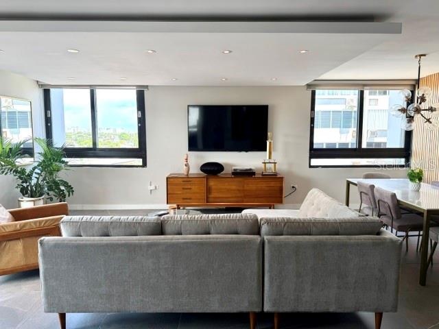 Enjoy this beautiful, modern  and completely remodeled corner apartment. Everything is done to move in. The property includes 2 bedrooms, 2  beautiful remodelled bathrooms with italian cabinets,  a very spacious living and dining area, a beautiful opened kitchen remodeled with italian  cabinets and equipped with excellent stainless steel appliances , dry bar  with italian cabinet and balcony. The apartment has porcelain tiles, ceiling fascias in kitchen, living and dining areas  among other beautiful extras. Direct view to  San Jose Lagoon from the balcony  and side view to Isla Verde Beach form the rest of the property.  The condominium has an elegant remodeled lobby,  24-hour security with a guard and controlled access, a  beachfront swimming pool and direct access to Isla Verde Beach. The apartment does not have parking space, but Seller have one rented that will be included and paid for one year. Also the building has water cistern and generator for common areas and coming soon a new Full Generator for the whole building.  The property conveniently  located very close to supermarket, excellent restaurants, pharmacy, many convenient stores, services and direct access to avenue and highway.