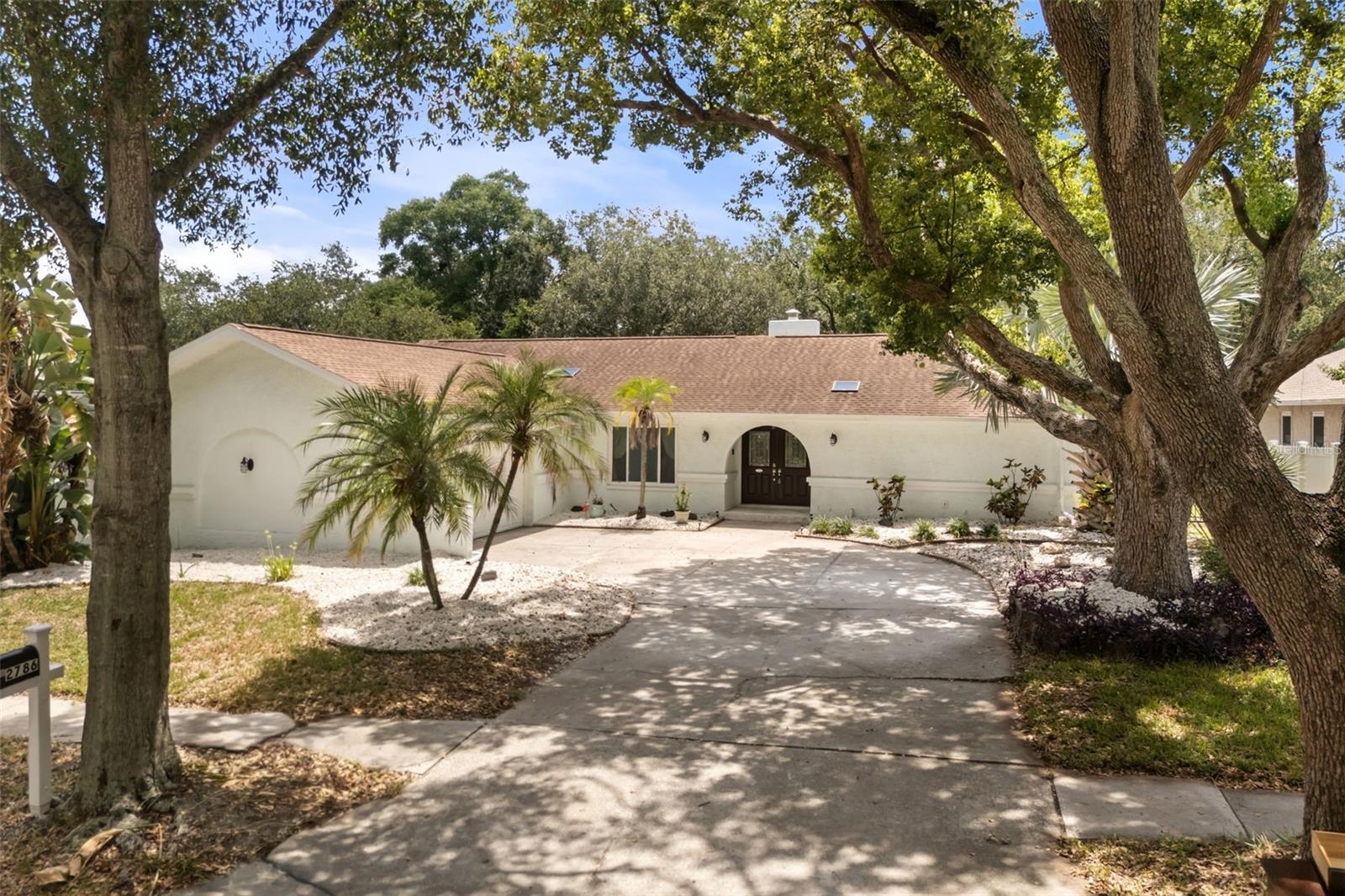 Welcome Home!  This 3 bedroom, 2 bath home is in a beautiful, mature development of Lake Valencia featuring tree lined streets and several bodies of water.  When you enter the home, you will immediately be impressed with the Living Room with a floor to ceiling fireplace and whitewashed cedar beams. To the left of the entry is a large Dining Room.  The kitchen has been updated this year and boasts some new stainless appliances, cabinets and quartz countertops. There is a large eating area in the kitchen and sliders out to the pool area.  Off the kitchen is an area used for an in-home office but could easily be made into a 4th bedroom.  To the right of the entry is the large Primary Bedroom with a ceiling fan, dual walk-in closets and a slider out to the pool area.  The Primary bath, also updated this year,  has a walk in shower with 2 shower heads, upgraded tile and a bench.  There are double sinks and a soaking tub as well.  To the left side of the house there are 2 other bedrooms both featuring ceiling fans and double closets.  The back yard is perfect for relaxing on a summers day.  The pool is gunite, salt water, and a screened cage (screens replaced last year) and a custom painted mural. Irrigation system 2025, windows 2020, Roof 2018, carpet main bedroom, 2025.  Seller to credit buyer a $2,000 credit for new carpet in 2 bedrooms, water softener 2026, water heater, 2026Stain Master laminate flooring in main area 2026.  SEE UPGRADES FLYER ATTACHED TO LISTING.