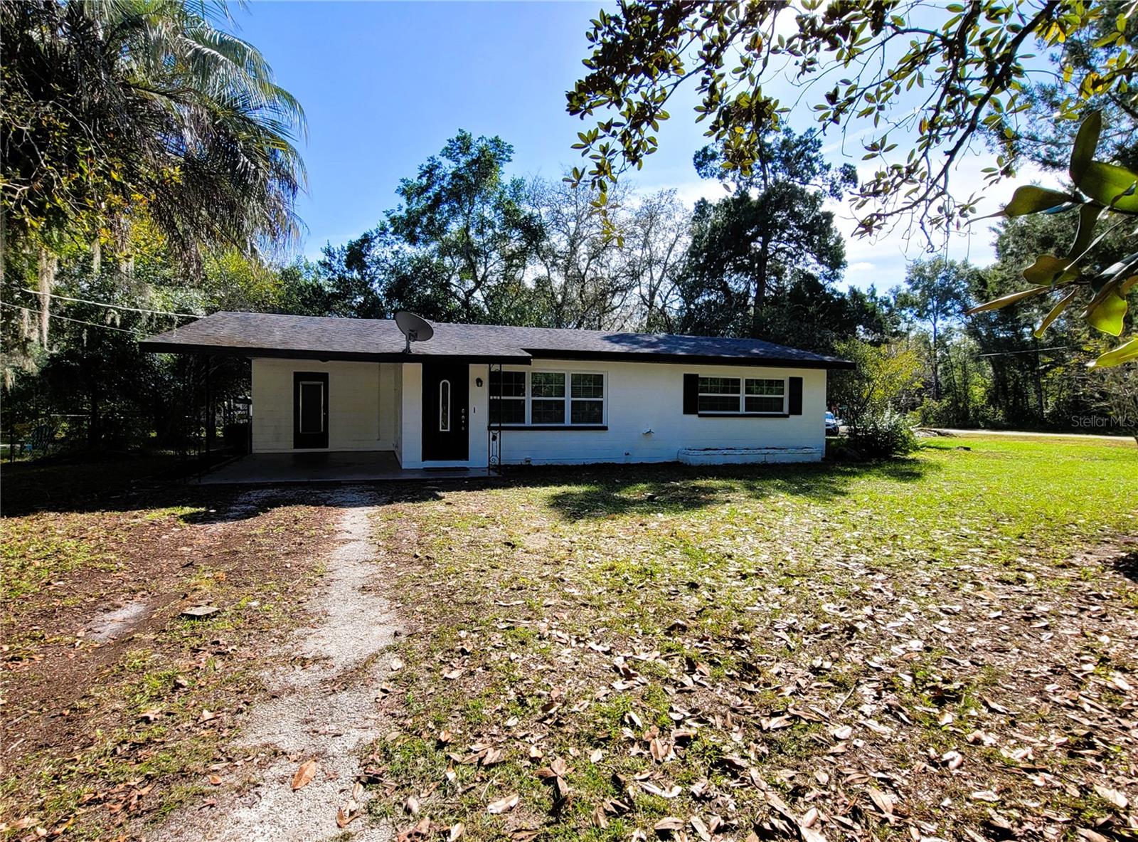 Why settle for an apartment when you can rent a home?? Available for immediate rental. Clean, updated 2bed/2ba sturdy block home on a very spacious .26 acre corner lot. Recent renovation includes new tile flooring throughout, new paint inside and out, new lighting, new ceiling fans, new AC system, new guest bath, and more!! Bright, refreshing kitchen features new appliances, new cabinetry, and new plumbing fixtures. Floor plan layout offers a living room with separate family room complete with wood burning fireplace . Enjoy grilling or
reading a book in comfort within the screen enclosed 9'x10' lanai which overlooks a stone fountain and the fenced back yard. Fenced yard offers a great play space for pets or children. Only 550' to nearby 41 acre Ridge Manor Community Park that includes basketball, baseball/softball field, volleyball, walking trail, picnic shelters, pavilions, gazebo, restrooms, concession, and playground.
