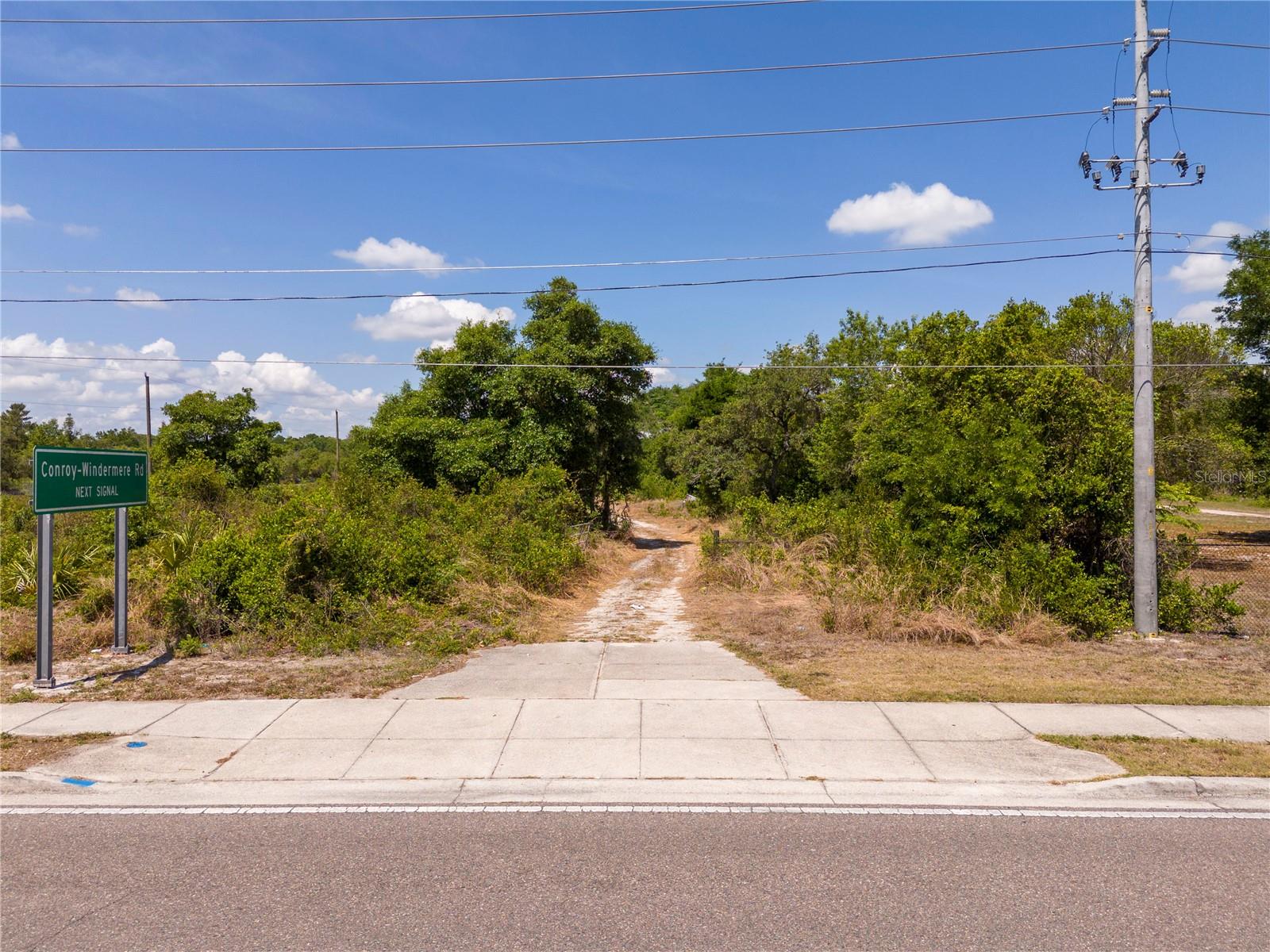 Investor opportunity in a desirable location with lakeside views, located just minutes from major theme parks, shopping, dining, and other area amenities. This 4+ acre parcel offers significant size and flexibility for potential future development. Due to its location and land area, the property may suit a variety of residential or investment uses, subject to zoning and local approvals. Opportunities of this size and location are limited in this area.