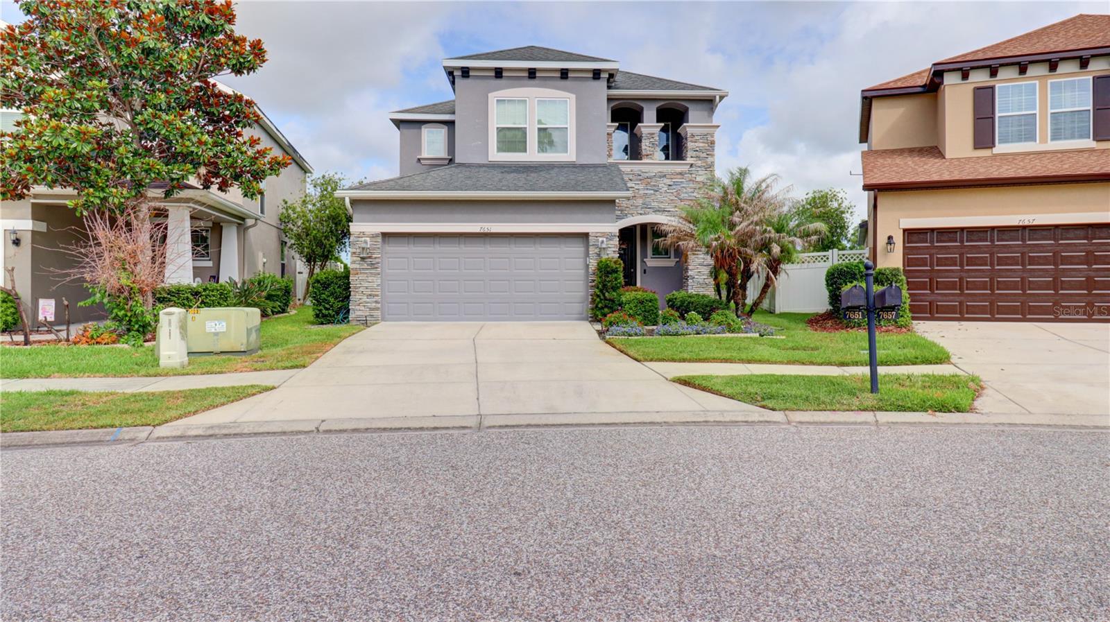 Welcome to this stunning, move-in ready two-story home in the highly sought-after Watergrass community of Wesley Chapel. Showcasing model-home appeal and modern design, this beautifully maintained residence is ideally situated on a premium conservation homesite with serene pond and wooded views.  Offering 2,297 square feet of thoughtfully designed living space, this home features 3 bedrooms, 2.5 bathrooms, a private office/den, spacious bonus loft, and a 2-car garage. The open-concept main level is highlighted by wood-look tile flooring, elegant 6-inch baseboards, and abundant natural light throughout. The chef-inspired kitchen is a true centerpiece, featuring 42-inch cabinetry, granite countertops, stainless steel appliances, a stylish stone backsplash, and a generous walk-in pantry complete with a custom organization system. The kitchen flows seamlessly into the dining and living areas, creating the perfect space for everyday living and entertaining. Step outside to the covered lanai and enjoy peaceful conservation and water views, providing a private backdrop for relaxing or hosting guests. The first floor also includes a dedicated office with French glass doors and a convenient half bath.
Upstairs, a versatile loft/bonus room offers endless possibilities as a media room, game room, fitness area, library, or additional living space. The spacious primary suite is privately positioned at the rear of the home to maximize the tranquil views and features a luxurious ensuite bath with dual vanities, a garden tub, separate shower, and a large walk-in closet with a custom closet system. Additional highlights include an upstairs laundry room with added cabinetry and shelving, an in-wall pest control system, and durable epoxy-coated garage flooring. Perfectly located directly across from the community pools and amenity center, this home offers unmatched convenience. Residents of Watergrass enjoy access to exceptional resort-style amenities, including a state-of-the-art clubhouse, three pools (including a junior Olympic lap pool), parks, playgrounds, open green spaces, dog parks, tennis courts, and a splash pad. Adding to its appeal, this home is zoned for highly rated Pasco County schools, making it an excellent choice for those seeking access to some of the area's most desirable educational opportunities.
Conveniently located just minutes from I-75, premier shopping, dining, and entertainment, this exceptional home combines luxury, comfort, convenience, and location. Don't miss the opportunity to own a beautiful home in one of Wesley Chapel's most sought-after communities. Schedule your private showing today!
