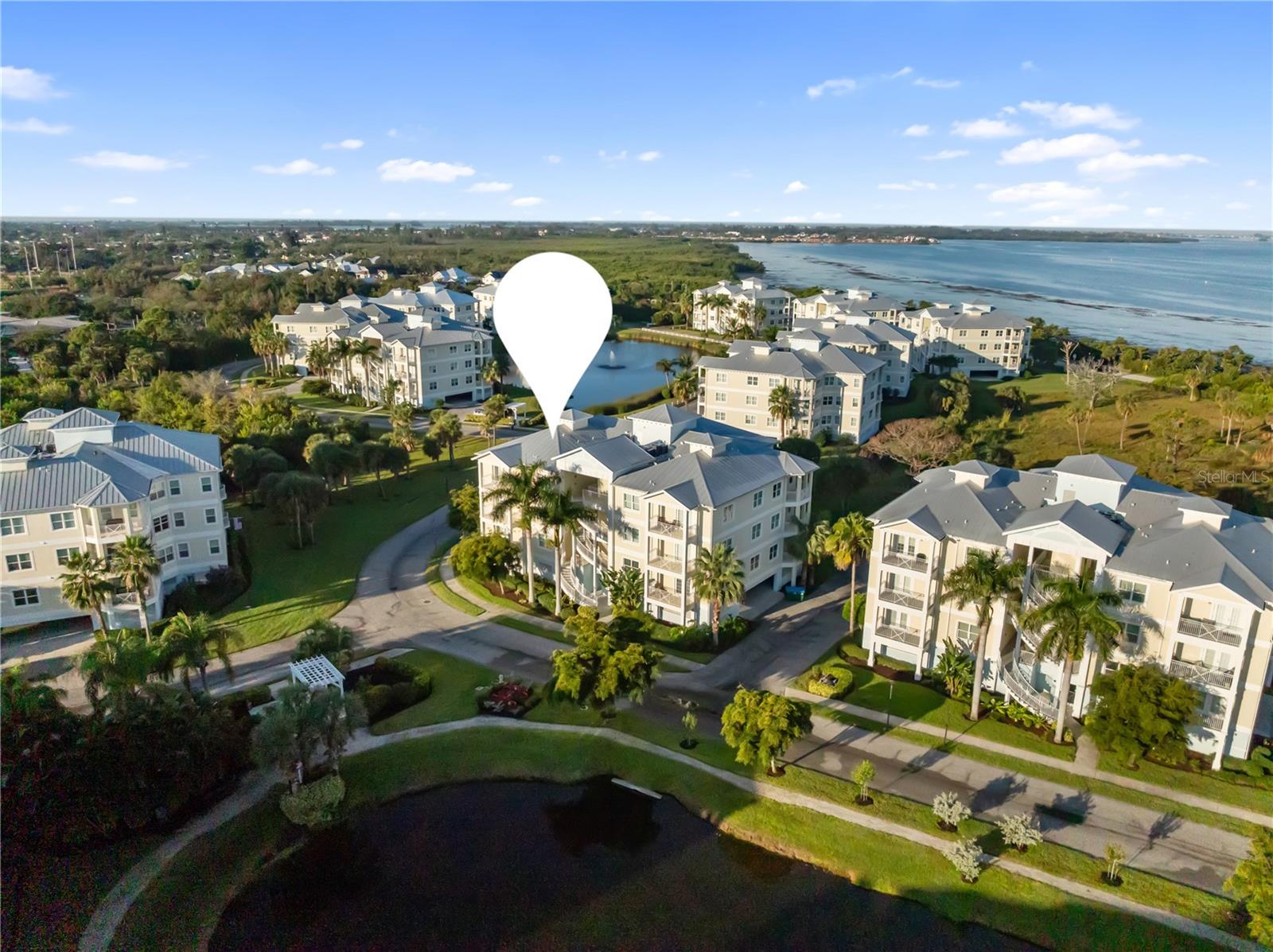 *xquisite Palma Sola Bay Club Condo with Style, Strength & Stunning Views!

Welcome to this beautifully designed first-floor residence in the highly desirable Palma Sola Bay Club. Built with durability and comfort in mind, this condo features full IMPACT glass windows and doors, offering exceptional peace, storm security, and energy efficiency. The building’s solid construction has proven itself through recent storms—remaining quiet, dry, and secure.

Step inside and experience a bright, open floor plan with elegant finishes throughout. The upgraded kitchen features a functional two-tier counter design that enhances prep space and flows seamlessly into the spacious gathering room—ideal for entertaining or relaxed everyday living. Enjoy tranquil pond views from your private balcony off the primary suite, perfect for morning coffee, and take in breathtaking sunsets from the second balcony overlooking the community.

The primary suite offers generous space, including a large walk-in closet, an oversized shower enclosure, and a relaxing garden tub. The split-bedroom layout provides added privacy for guests, while the expansive interior laundry room, abundant cabinetry, and a conveniently located half bath make daily living effortless.

This home also includes a large walk-in storage room on the ground level—perfect for kayaks, beach gear, bikes, or seasonal items—as well as two dedicated parking spaces.

With the sellers relocating back north, this impeccably maintained condo is ready for its next owner to enjoy the serene, coastal lifestyle that Palma Sola Bay Club is known for. Don’t miss this rare opportunity to own a truly exceptional property in one of Bradenton’s most sought-after communities!