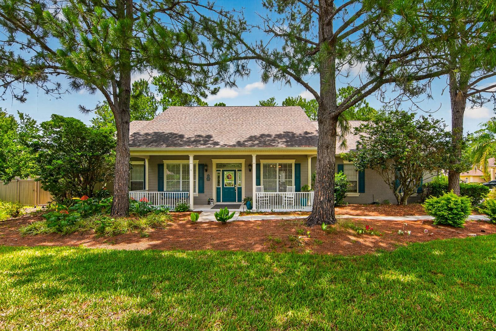 Tucked away on 1.16 private acres within the exclusive gated community of SaddleRidge Estates, this exceptional 4-bedroom, 3-bathroom pool home offers over 3,100 square feet of elegant single-story living with a 3-car garage.

From the moment you arrive, the charming covered front porch welcomes you with timeless country-style appeal and a peaceful setting surrounded by mature landscaping. Inside, you'll find a thoughtfully designed split-bedroom floor plan featuring formal living and dining rooms with architectural columns, tray ceilings, and abundant natural light.

At the heart of the home is a beautifully appointed kitchen designed for both everyday living and entertaining. Highlights include granite countertops, a massive center island with prep sink, newer stainless steel appliances, extensive cabinetry, a walk-in pantry, and a spacious breakfast nook overlooking the pool area. The kitchen opens seamlessly to the expansive great room, where soaring vaulted ceilings and updated wood-look tile flooring create an inviting gathering space.

The private owner's suite occupies its own wing of the home and features dual walk-in closets, direct access to the outdoor living area, and a spacious ensuite bath complete with dual vanities, a garden tub, and separate walk-in shower.

On the opposite side of the home, three additional bedrooms and two full bathrooms provide comfortable accommodations for family and guests. One oversized bedroom offers incredible flexibility and could easily serve as a home office, media room, guest retreat, or in-law suite.

Outdoor living is where this home truly shines. Triple sliders open to an enormous screened lanai overlooking the heated pool and spa, creating a true backyard oasis. With nearly 1,800 square feet of covered and screened outdoor space, there's plenty of room for entertaining, relaxing, and enjoying Florida's year-round sunshine.

Additional features include a dedicated laundry room with storage, a 3-car garage, updated flooring, and a highly desirable location that offers both privacy and convenience, just minutes from shopping, dining, and everyday amenities.

A rare opportunity to own a spacious estate home on over an acre in one of the area's most sought-after gated communities.