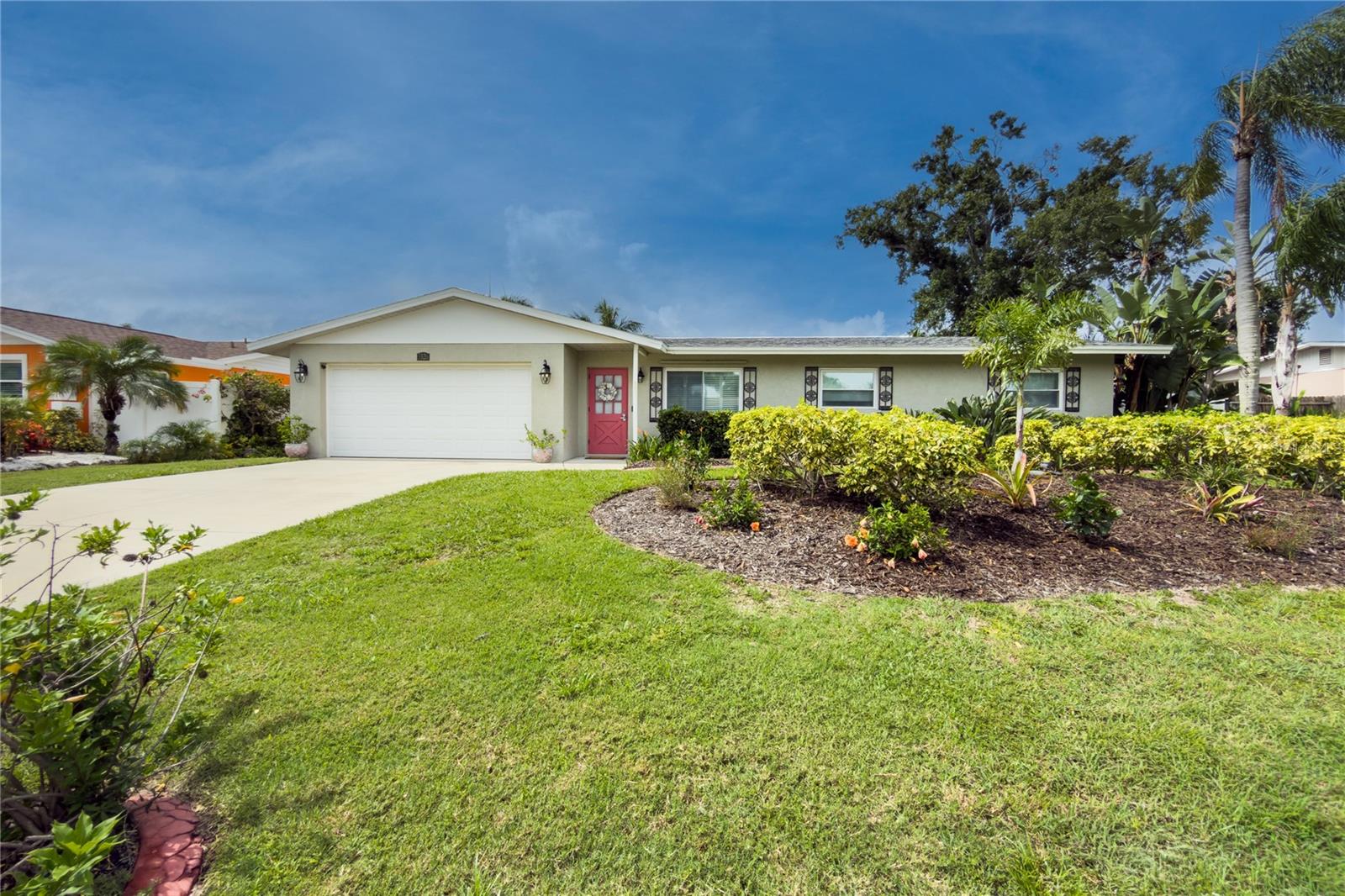 DON'T MISS this South Gate beauty — This meticulously cared-for 3 bed/2.5 bath pool home is centrally located to everything Sarasota has to offer. Step outside into your own private tropical paradise: The fully fenced yard boasts lush, professionally designed landscaping with LED accent lighting and wraps the saltwater pool, large paver brick deck, gazebo, and outdoor living spaces, creating a resort-like setting for entertaining or simply unwinding and recharging. Soak in the included 4-person hot tub, rinse off at the outdoor shower, or retreat to the beautifully finished, air-conditioned outbuilding — ideal as a studio, workshop, home office, or reading retreat. 
Inside the house, custom wood cabinetry, stainless steel appliances, and sleek granite countertops elevate the kitchen. Porcelain "plank" flooring in the bedrooms and ceramic in the living areas keep maintenance low, while a jetted spa tub in the main bath offers a relaxing soak for owners and guests alike. The indoor laundry room/pool bath keeps wet feet out of the main living space. This home should be the very last stop in your search. 
Major systems have been thoughtfully updated: new roofs - main and flat (6/26), AC ('24), water heater (2019), and irrigation system with well (new pump 6/26) — plus too many extras to mention. Select furnishings are available for purchase outside of the transaction; digital catalog available upon request. ***NOTE: Washer, dryer and laundry room fridge do not convey
