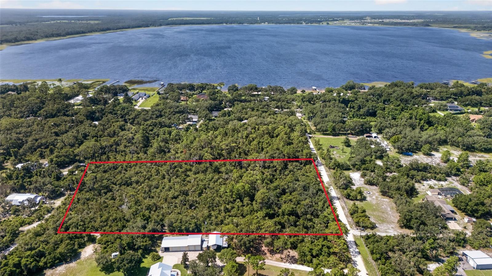Discover 4.88 wooded acres in St. Cloud offering privacy, space, and investment potential. This undeveloped parcel features approximately 321 feet of frontage along Wilson Road and estimated lot dimensions of 321 x 679 feet. Enjoy a peaceful rural setting while remaining within reach of St. Cloud’s shopping, dining, schools, lakes, and everyday conveniences. Whether you are considering a future homesite, recreational retreat, or long-term land investment, this property offers an exciting opportunity to own a substantial piece of Central Florida. The property is currently wooded and unimproved. Lot dimensions and road frontage are approximate and based on public records and GIS mapping.