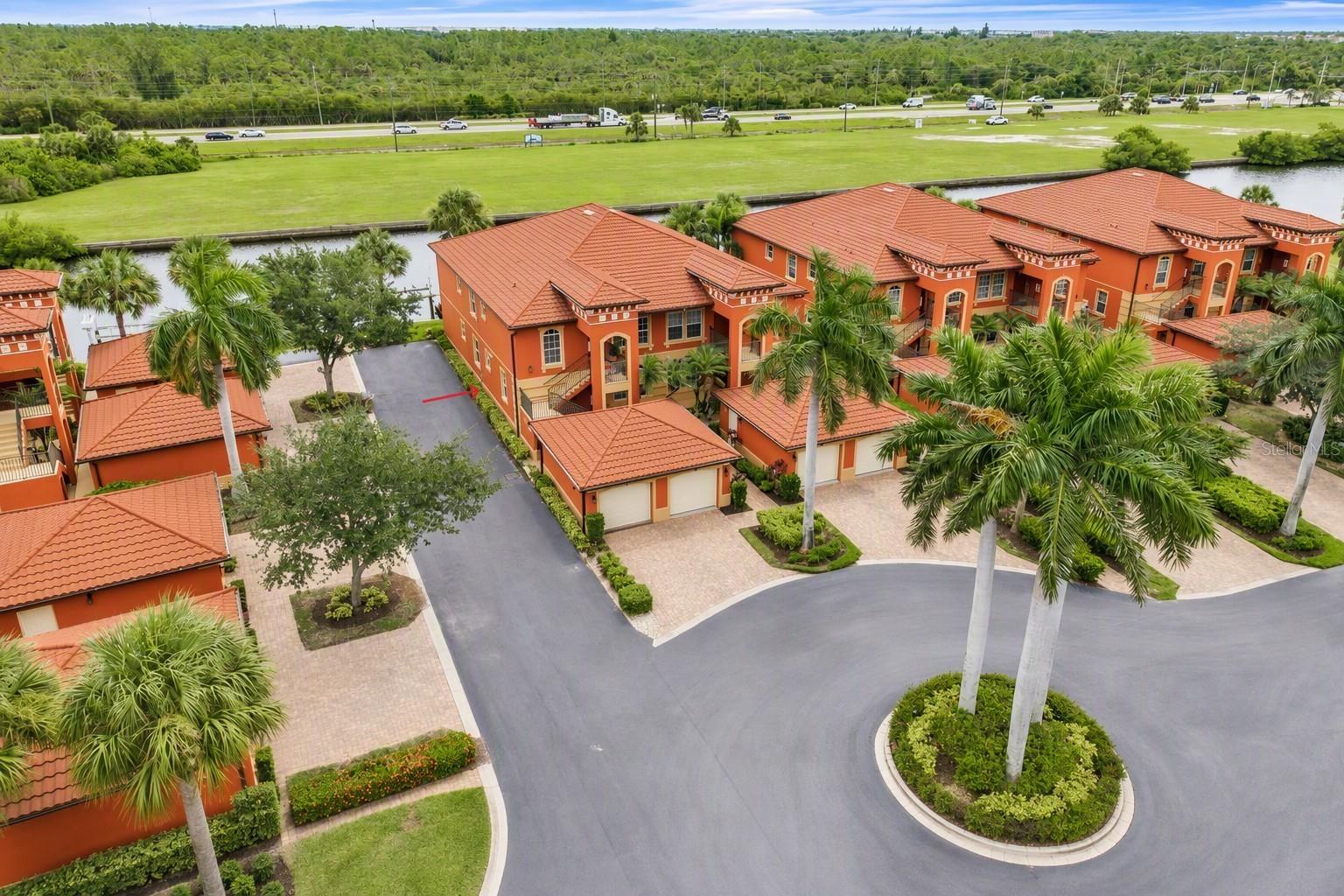 Welcome to resort-style living in this sailboat waterfront, ground-floor Mediterranean style villa located in the highly sought-after Mondovi Bay Villas community of Burnt Store Isles. This beautifully maintained 3-bedroom, 2-bath residence includes a private 1-car garage and a deeded dock with a 10,000-pound boat lift just steps from your door. From your dock, enjoy quick access to Charlotte Harbor and the sparkling waters of the Gulf of Mexico, making this a true boater's paradise. The bright, open floor plan is filled with natural light and designed to maximize the stunning waterfront setting. Sliding glass doors from the living area open to a spacious screened lanai overlooking the canal, providing the perfect place to enjoy breathtaking sunrises and tranquil water views. Open the sliders and seamlessly blend indoor and outdoor living, creating a light-filled, coastal atmosphere. Tastefully appointed throughout, the home features 18-inch tile flooring in the main living areas, new wood-look tile in the bedrooms, a separate dining area, and a freshly repainted interior that gives the residence a crisp, move-in-ready appeal. The well-appointed kitchen is a chef's delight, offering granite countertops, raised-panel wood cabinetry, a pantry closet, and a breakfast bar accented with stylish pendant lighting that overlooks the living area, making entertaining effortless. The spacious primary suite serves as a private retreat, featuring two walk-in closets, direct lanai access, and beautiful water views. The ensuite bath is bright and inviting, offering an expansive vanity with abundant storage, a wall-to-wall mirror, a large privacy window, and a glass-enclosed walk-in shower, creating a spa-like ambiance for everyday relaxation. Two generously sized guest bedrooms are situated at the front of the home, one featuring a walk-in closet, and share a well-appointed full bath. Additional highlights include a new metal roof, impact-resistant windows and doors, hurricane-rated garage door, dedicated laundry area with washer and dryer, brick-paver driveway and walkway, and water and sewer service included in the condominium fee. The garage also offers valuable additional storage space with pull-down attic access. Residents of Mondovi Bay Villas enjoy a wealth of resort-style amenities, including a heated pool and spa, cabana with BBQ grills, clubhouse, and meticulously landscaped grounds. The community's prime location places you close to boating, fishing, waterfront dining, shopping, golf courses, and Gulf beaches. Nearby parks offer walking and biking trails, picnic areas, boat ramps, and access to Charlotte Harbor, the Peace and Myakka Rivers, and countless waterways waiting to be explored. Historic downtown Punta Gorda and vibrant Fishermen's Village are just minutes away, offering charming boutiques, restaurants, and year-round events. Convenient access to I-75 makes travel easy, with Fort Myers and Naples to the south and Sarasota and Tampa to the north. Experience the best of Southwest Florida waterfront living in this quiet, amenity-rich community where boating, relaxation, and convenience come together. Your Florida dream lifestyle starts here.
**PLEASE ENJOY THE 3D INTERACTIVE VIRTUAL TOUR ASSOCIATED WITH THIS LISTING**
