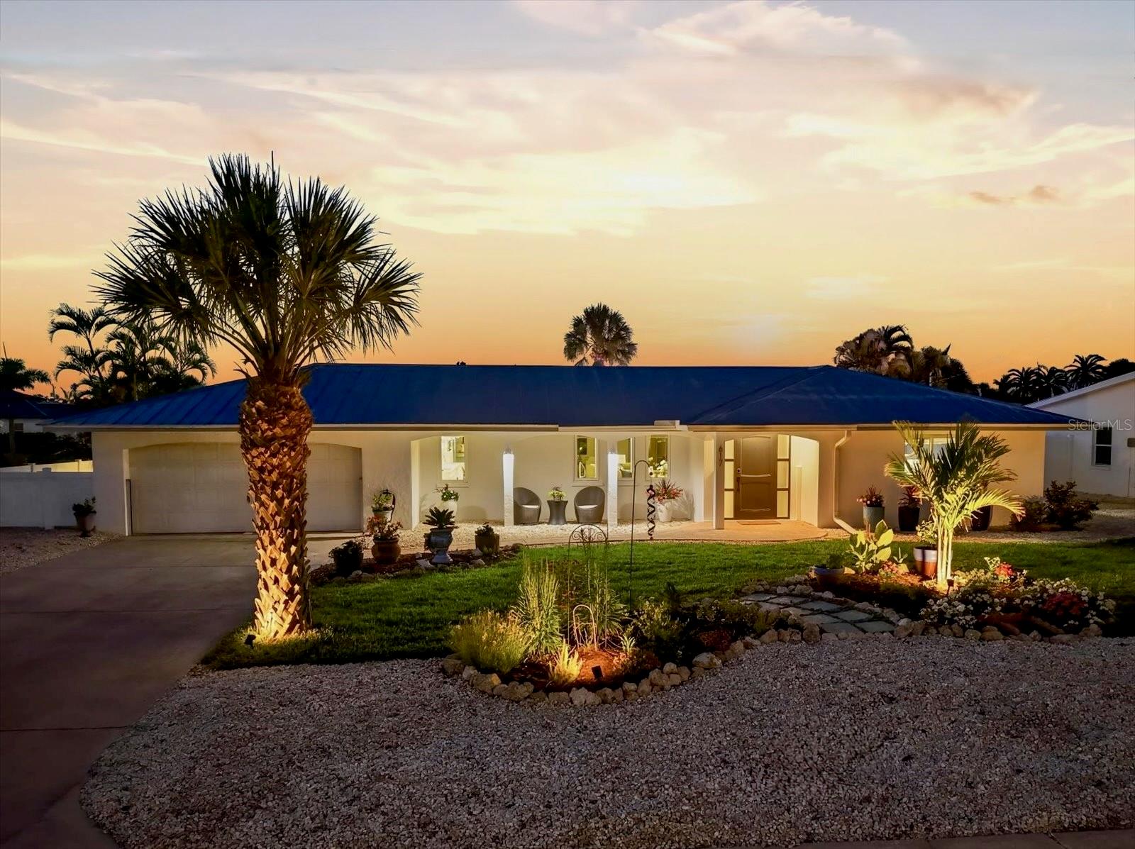 Welcome to your light-filled Key Royale retreat—an effortlessly elegant coastal charmer on Anna Maria Island. Beautifully refreshed and thoughtfully designed, this home embraces the best of indoor-outdoor living with an open floor plan and walls of sliding glass doors that frame sparkling pool and tranquil water views.

As you enter the home, you’re greeted by a bright and spacious living room with inviting views of the outdoors beyond. This welcoming space flows seamlessly into the kitchen and dining area, creating the perfect setting for indoor/outdoor entertaining and everyday enjoyment as living room opens to a covered patio, offering generous space for outdoor dining and lounging.

At the heart of the home, a brand-new kitchen shines with a large island, breakfast bar, and dedicated dining area—perfect for gathering and hosting. A well-appointed butler’s pantry adds both function and style, featuring a desk workspace, second sink, and ample cabinetry. Enjoy cooking with top-tier appliances, including dual ovens and sleek induction cooktop.

The spacious primary suite is a private sanctuary, where sliders and French doors lead to a serene backyard and a charming back porch—ideal for unwinding with evening cocktails as the sun sets. This sanctuary is also appointed with an ample walk- in closet for your comfort and convenience.

Step outside to your own tropical oasis: a sparkling pool and spa, lush lawn, and a sandy beach area complete with a cozy fire pit. Boating enthusiasts will love the oversized dock equipped with a 10,000 lb boat lift, providing gorgeous sunset views over Bimini Bay and direct access to the Gulf, Tampa Bay, and the Intracoastal Waterway.

Beyond the beauty, thoughtful upgrades provide peace of mind. In 2022 the seawall was replaced and sewer pipes were scoped and lined with PVC, a flood mitigation system has been installed, and all windows are hurricane-rated. 

This is more than a home—it’s a lifestyle. Start your mornings with sunlight dancing on the water, spend afternoons cruising the bay or playing a round at the nearby Key Royale Club, and end your days exploring Anna Maria Island’s renowned beaches, boutique shops, and charming restaurants. This property is a true island gem, perfectly capturing the relaxed elegance of coastal living.