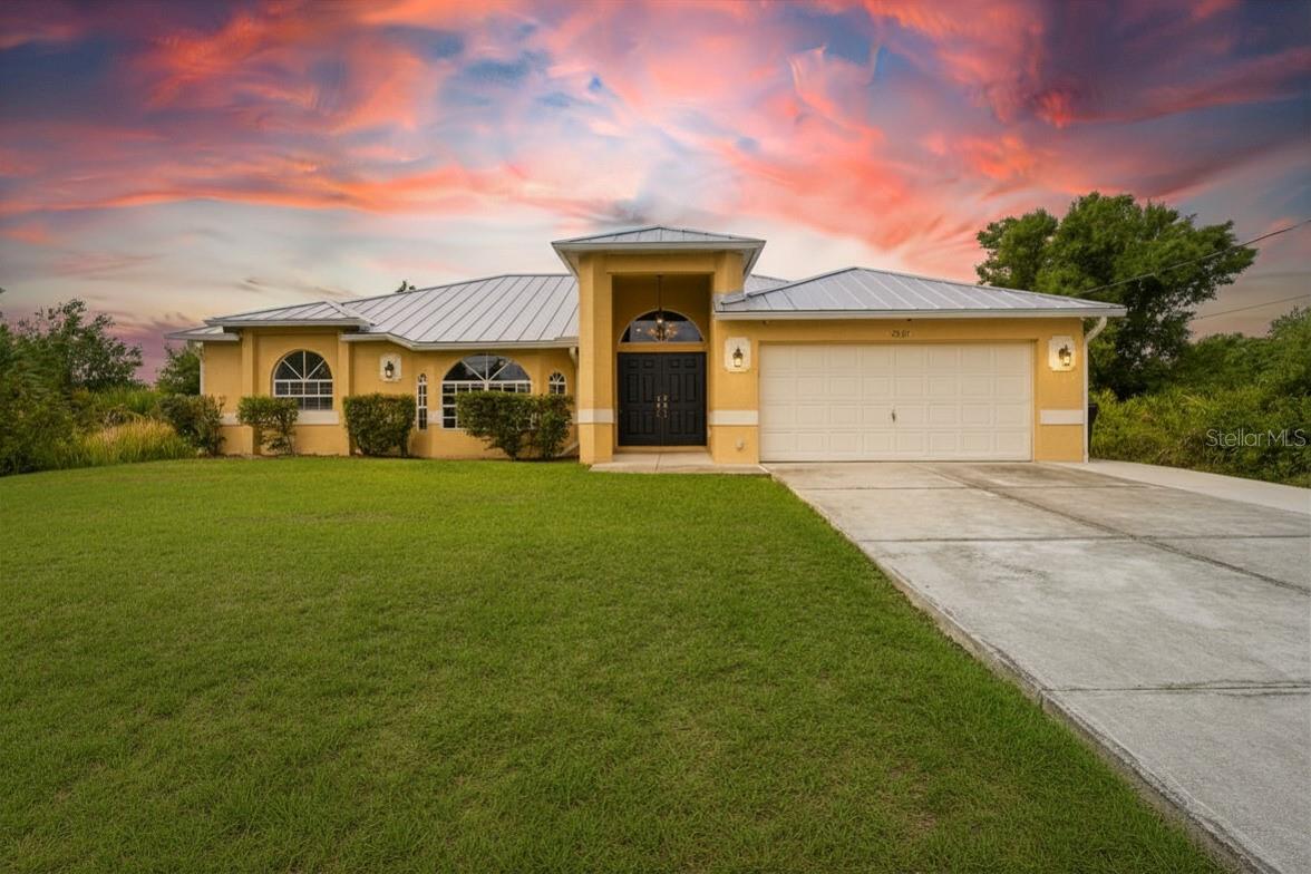 For the buyer that knows the value of a Metal Roof, Owned Solar Panels with $0 balance, not leased, no loan, paid for Solar! and Not in a flood zone, better value than new construction. Welcome to this beautifully updated 3-bedroom, 2-bath split floor plan home in the heart of North Port, offering the perfect blend of comfort, efficiency, privacy, and convenience. Major upgrades make this property an exceptional value, including paid-off and owned solar panels, a newer metal roof (2023), brand-new water heater (2025), salt-free water softener system, new stainless steel kitchen appliances, granite countertops, and new luxury vinyl plank flooring. Located in Flood Zone X, no flood insurance is required, plus enjoy the added benefit of NO HOA and NO CDD fees.

Designed with both everyday living and entertaining in mind, the spacious split-bedroom layout provides added privacy, with the primary suite tucked away on its own side of the home. The oversized primary retreat features a walk-in closet and an en suite bath complete with dual sinks, a relaxing soaker tub, and a separate walk-in shower. Every bedroom offers walk-in closet space, adding to the home’s functionality and storage.

At the center of the home, the open kitchen overlooks the main living areas and features granite countertops, a breakfast bar, new stainless steel appliances, and seamless flow into the dining and family room combination. An additional separate living room offers flexibility for entertaining or additional gathering space.

Step outside and enjoy Florida living year-round from the expansive enclosed lanai, featuring sliding glass doors on three sides and a convenient pass-through window from the kitchen—perfect for hosting guests or simply relaxing while overlooking the private backyard with plenty of room to create your own outdoor oasis.

Additional features include a dedicated laundry room with sink and washer/dryer hookups, plus a 24-hour high-definition security system with 16 cameras for added peace of mind.

Perfectly positioned between Tampa and Fort Myers, this home offers exceptional access throughout Southwest Florida. Everyday conveniences are just minutes away, including grocery stores, dining, pharmacies, medical offices, and Cocoplum Village Shops. Enjoy nearby attractions such as the North Port Aquatic Center, Wellen Park, CoolToday Park—home of Atlanta Braves Spring Training—and Charlotte Sports Park, where the Tampa Bay Rays train. Outdoor enthusiasts will appreciate close proximity to Gulf beaches, Warm Mineral Springs, Myakkahatchee Creek Environmental Park, Myakka State Forest, scenic parks, trails, and year-round community events including farmers markets, festivals, fairs, and movies in the Park at Wellen Park and the City Green.

Convenient access to I-75 and US-41 makes commuting simple and convenient. Located just minutes from the new Sarasota Memorial Hospital campus currently being built off Sumter Blvd. This home truly offers comfort, efficiency, location, and lifestyle all in one.